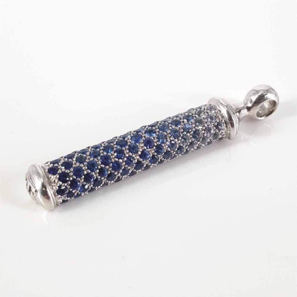 This Stunningly Designed 18 Carat white gold pendant is carefully set with 828 round brilliant cut sapphires weighing 4.14 carat in total. This Pendant is 47mm in length and weighs 11.5 grams.