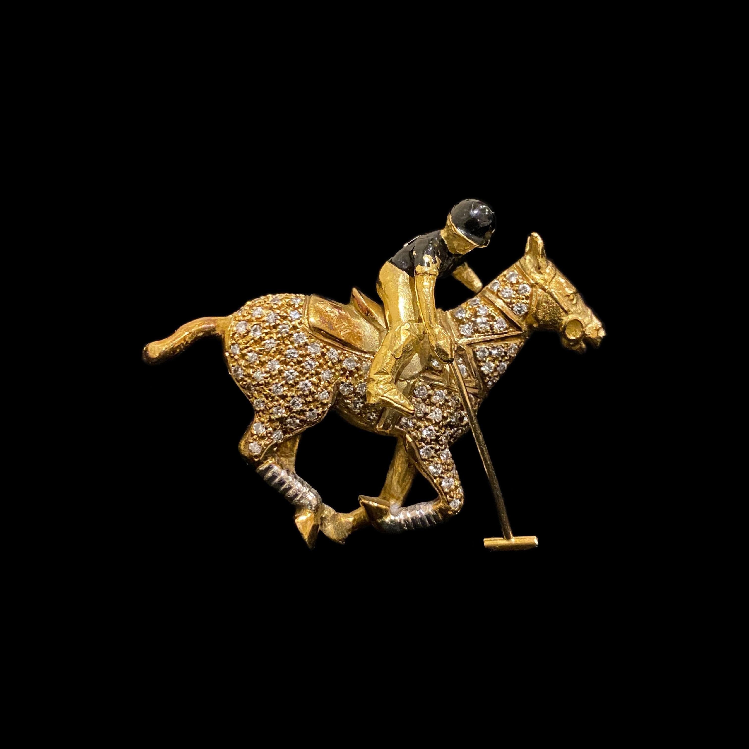 Theo Fennell 1980s Diamond and Enamel Articulated Polo Player on Pony Horse Brooch in 18 Karat Yellow Gold. Great on and off the pitch!

Designed as a polo pony and articulated player, the pony’s body is pavé-set throughout with round brilliant-cut