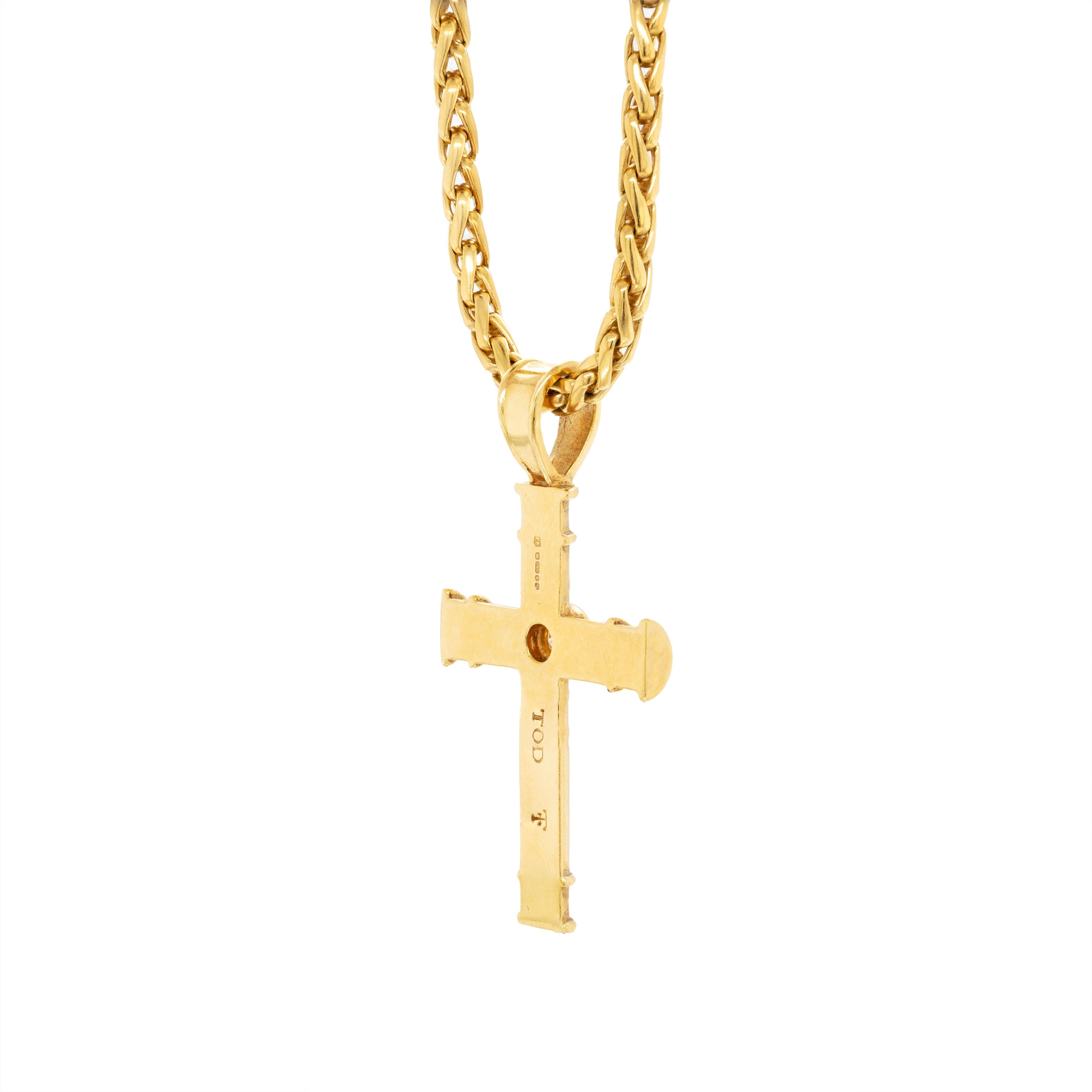Theo Fennel solid 18 carat gold cross pendant set with a round brilliant cut fine quality diamond of approximately 0.30 carats in a rub-over open back setting. The pendant measures 45mm by 24mm and weighs 9.2 grams and comes with a Theo Fennel,