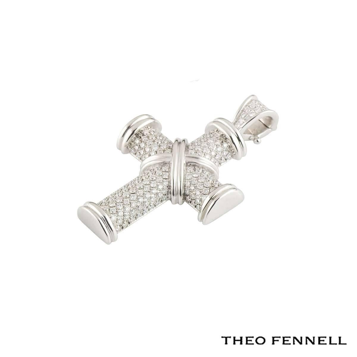 A sparkly 18k white gold Theo Fennell diamond pendant from the Crosses collection. The pendant comprises of a cross motif with 191 pave set round brilliant cut diamonds totalling approximately 1.28ct, G colour and VS clarity. The pendant measures
