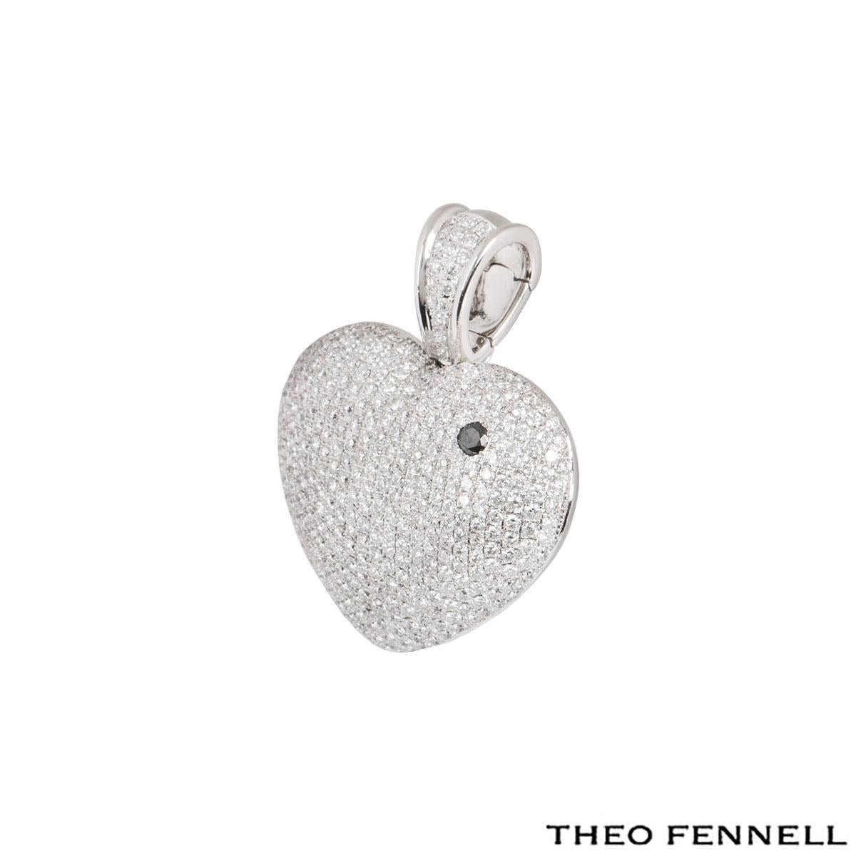 An 18k white gold diamond heart pendant by Theo Fennell from the 'Art collection. The heart motif pendant is set with pave round brilliant cut diamonds with a single black one. There are approximately 252 round brilliant cut diamonds with an