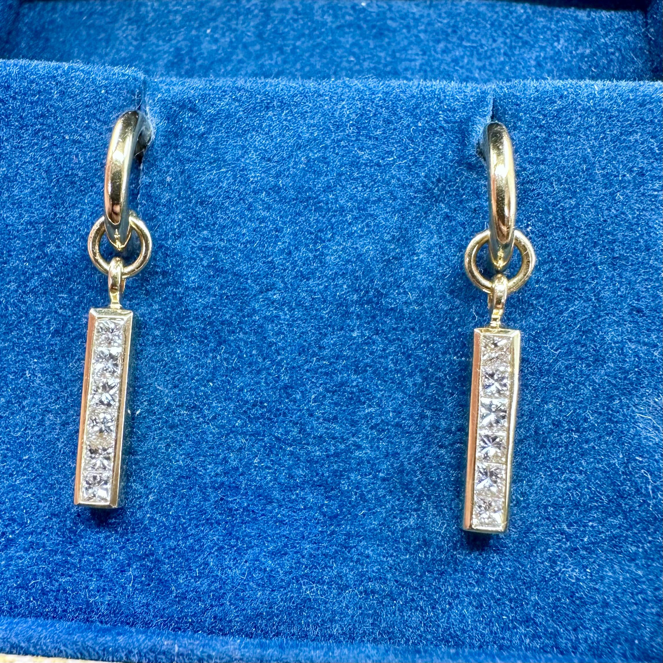 Theo Fennell 
Diamond Dangle Earrings Featuring 12 Princess Cut Diamonds and 18 k Yellow Gold Strip Collections  Est 1.00 cts of Diamonds
With original box. 
Dimension: 1.00 inch drop earrings
Hallmark: TF for Theo Fennell
also available is the