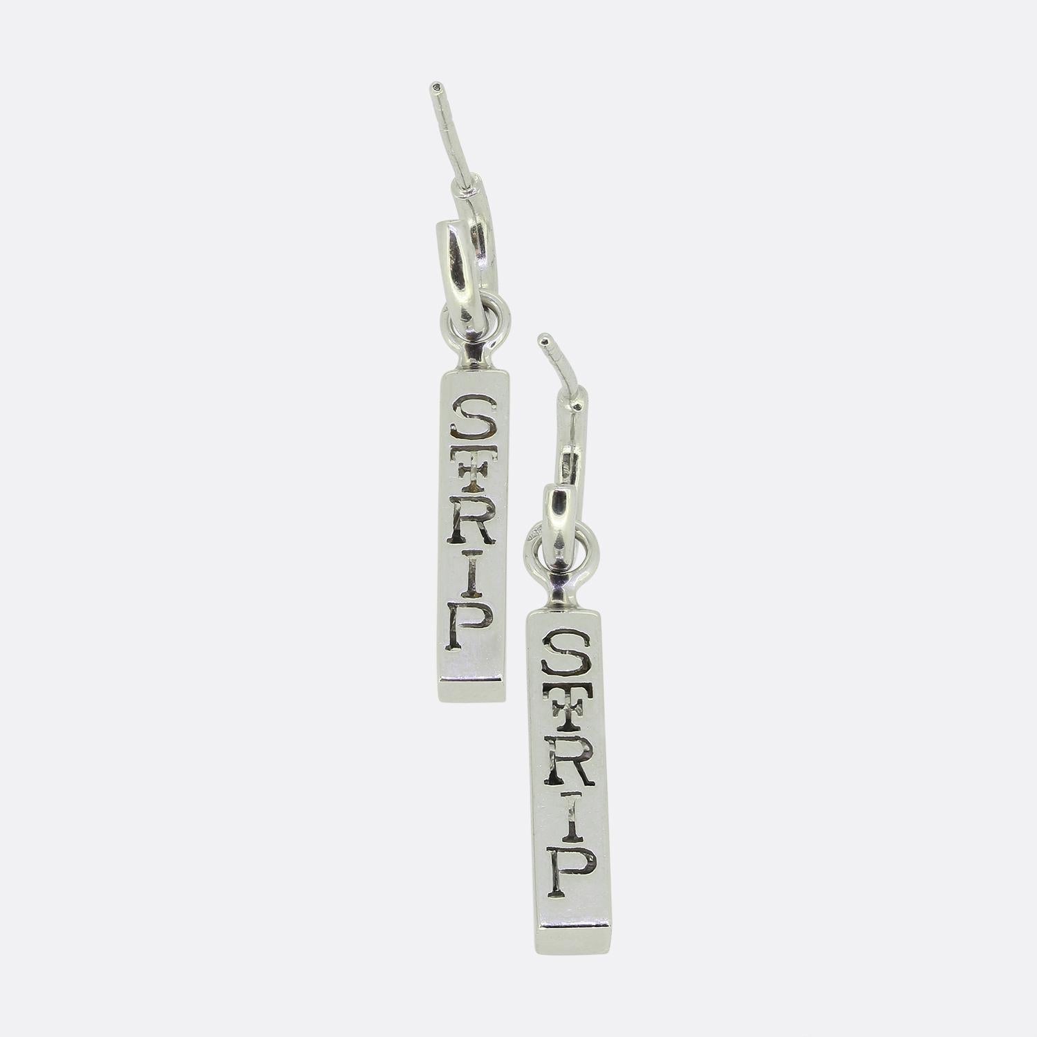 Here we have a wonderful pair of diamond drop earrings from renowned British jewellery designer, Theo Fennell. Each identical 18ct gold piece features six perfectly matched princess cut diamonds; all of which have been bezel-set in a vertical