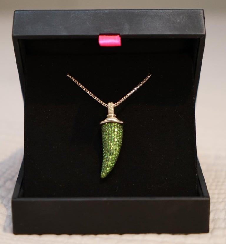 Wimbledon-Furniture are delighted to offer for sale this lovely Theo Fennell 18-carat white gold tsavorite garnet and diamond horn pendant and earring suite approximate TCW 4.0 RRP £13,000

An 18-carat white gold tsavorite garnet and diamond 'Horn'