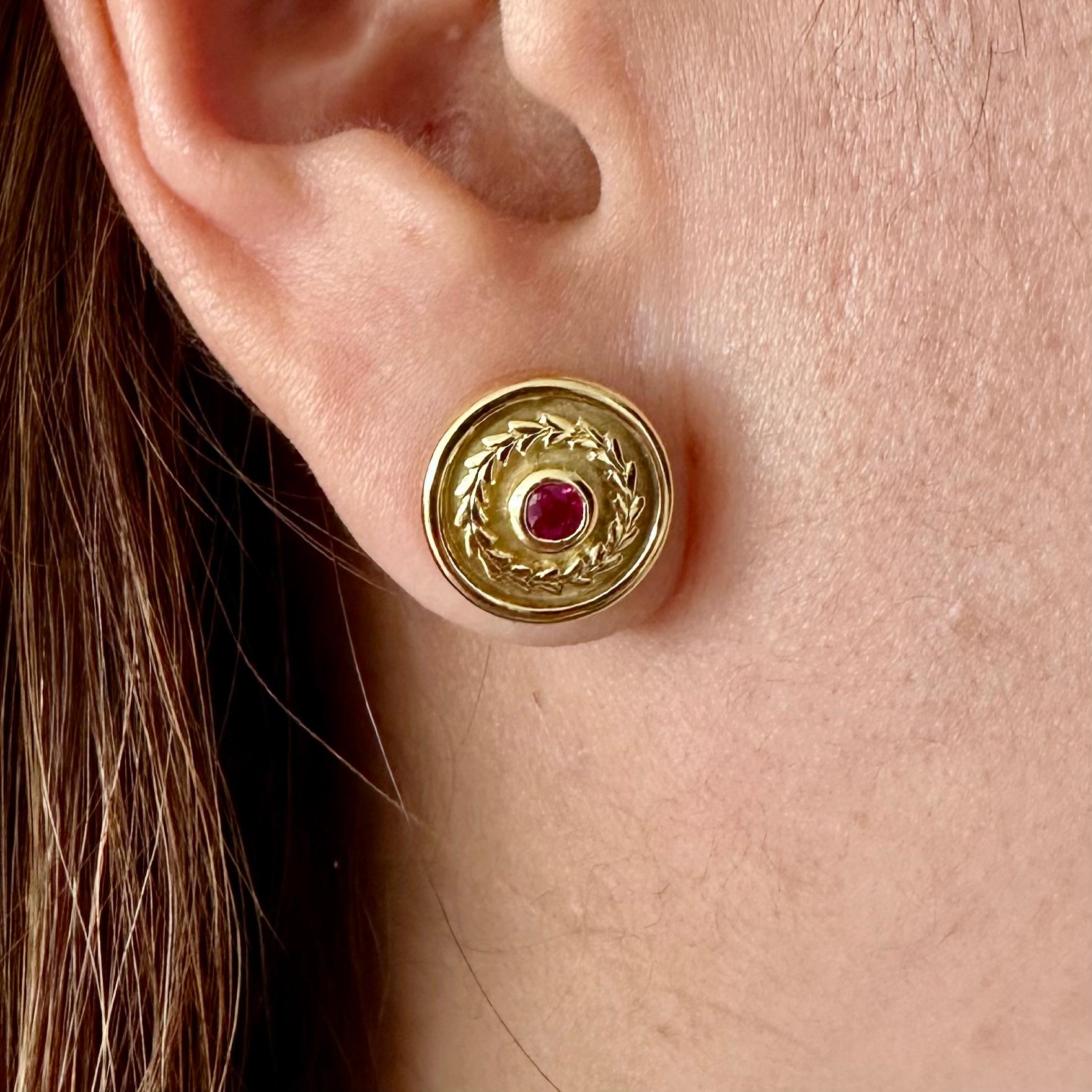 Theo Fennell
Lief Earrings with Round Ruby 
Stud Earring with Friction Backs 
Diameter: 12.5 mm 
Beautiful Deep Red Rubies est .25 CTS
9.2g 18k 
With original box
Hallmark Fennell and Lief, on the side of the earring is Hallmark TF with numerous