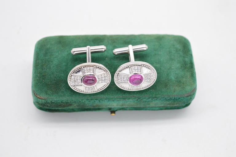 This fantastic pair of 18ct white gold cufflinks was masterfully crafted by Theo Fennell, a jeweller famed for his unique and innovative designs

They feature a large ruby cabochon surrounded by a cluster of perfect diamonds forming a Maltese cross