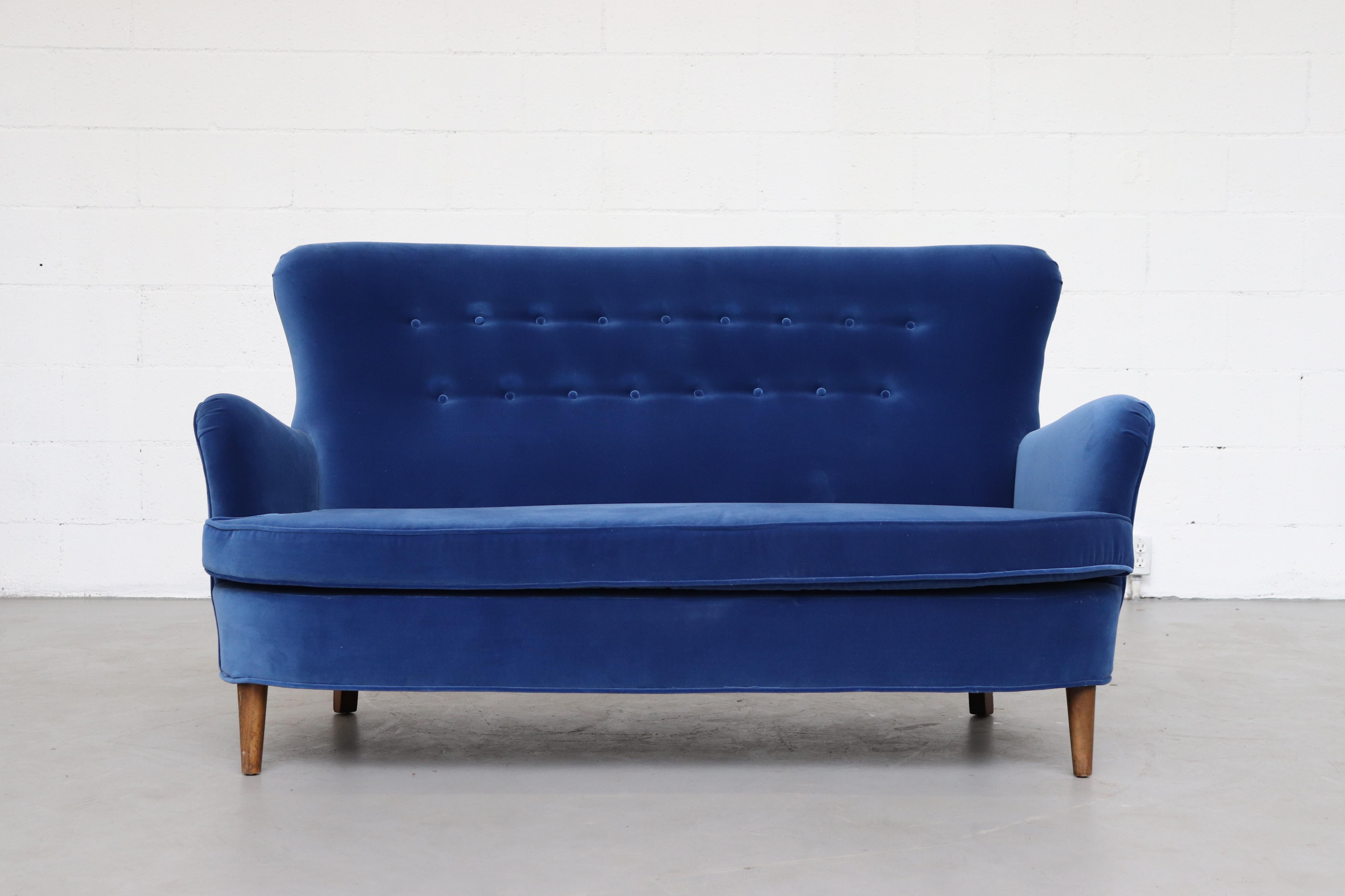 Theo Ruth loveseat by Artifort in newly upholstered cobalt blue velvet with tapered legs, in original condition. Finn Juhl Similarity.