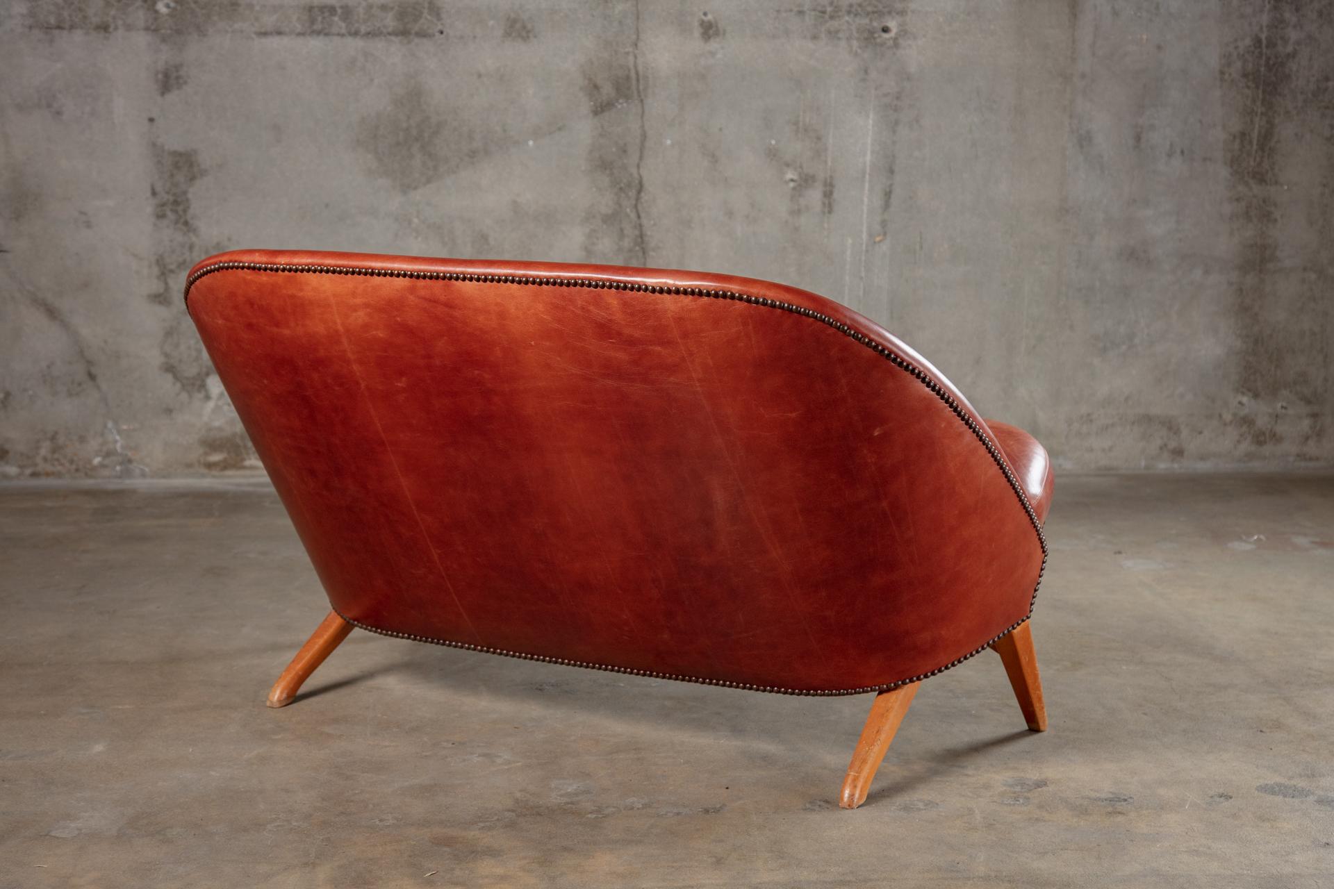 Theo Ruth leather upholstered settee.