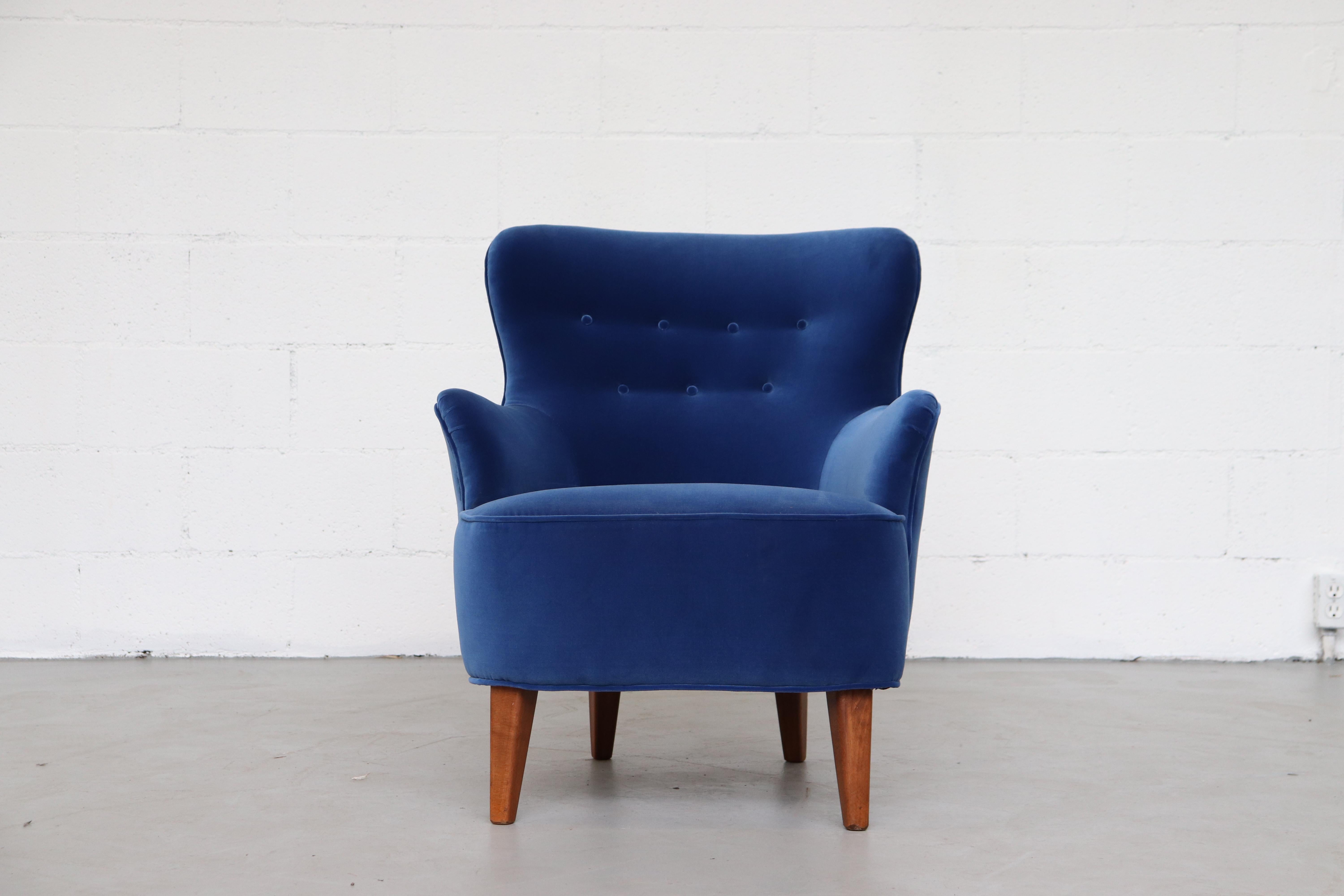 Theo Ruth lounge armchair for Artifort in brand new cobalt blue velvet upholstery. Lightly refinished Tapered legs.