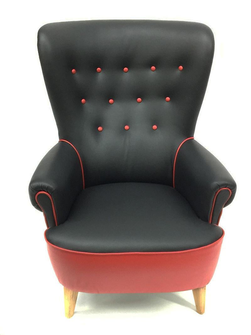 Leather Lounge Chair by Theo Ruth for Artifort, 1950s

A beautiful leather lounge chair with a highly winged back
2 toned in new upholstered high quality Italian black and red leather with red trim and buttons
Dutch, 1950s
The measurement  for the