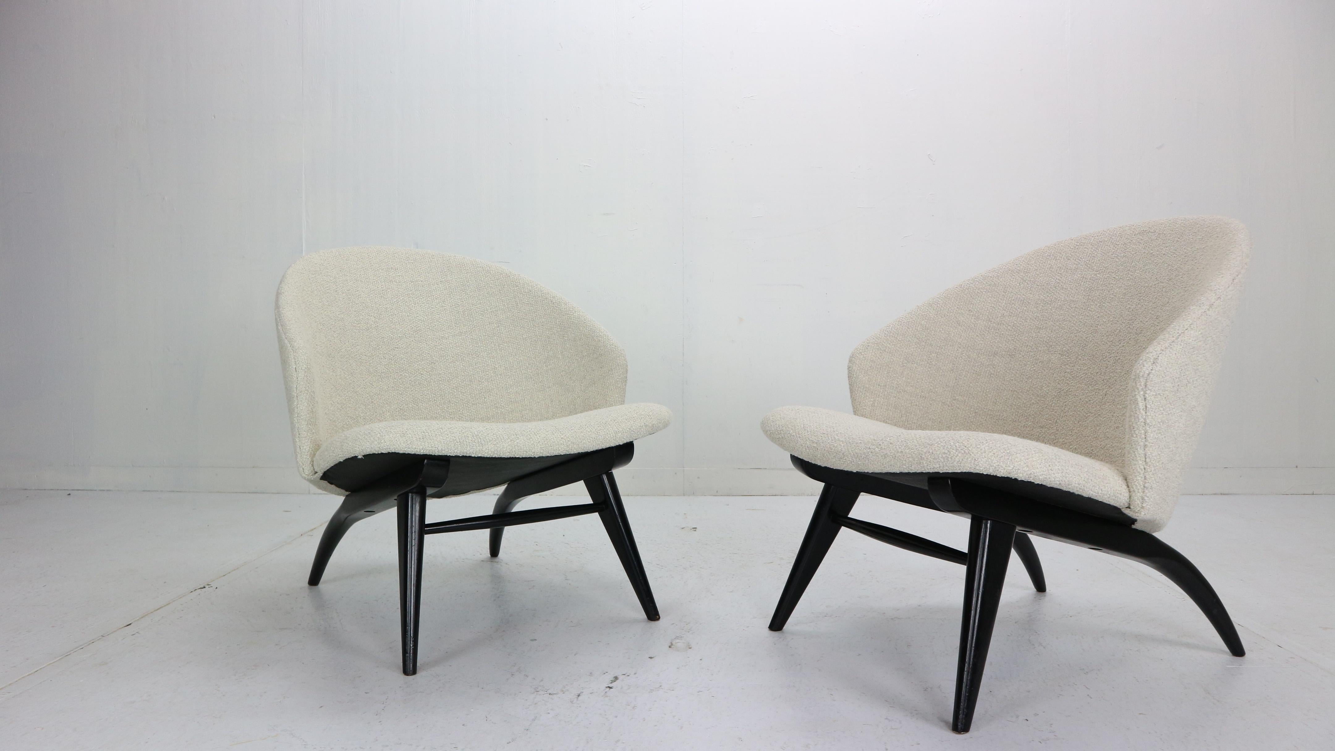 Set of two lounge chairs designed by Theo Ruth and manufactured by famous Dutch furniture fabric Artifort in 1950s period.

The chairs has been newly upholstered with light bouclé fabric, black painted wooden feet makes a nice contrast between