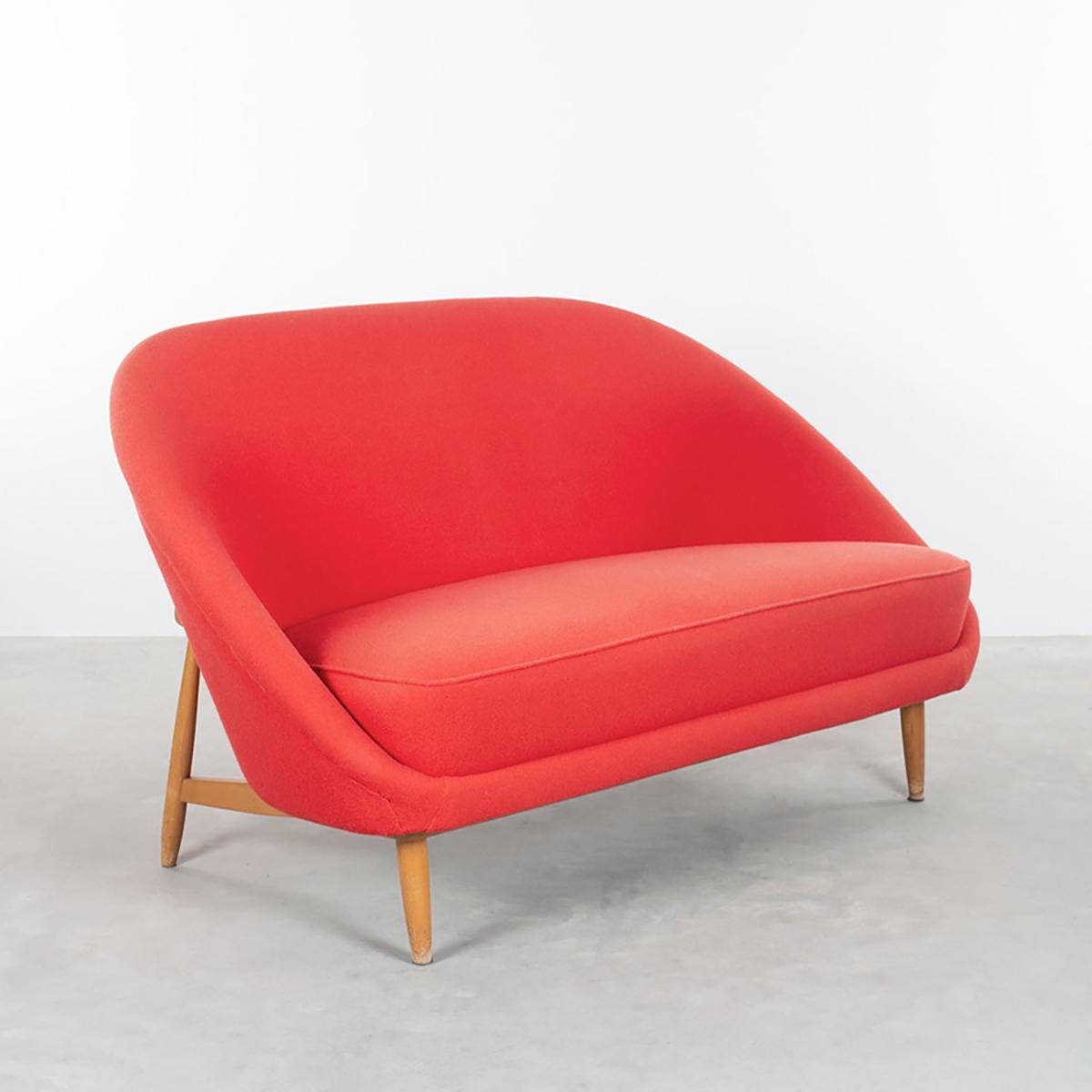 Theo Ruth small sofa / loveseat Model 115 for Artifort, the Netherlands 1957. Wooden frame with shell upholstered in red wool (later upholstery) in good condition. Light wear frame mainly legs. We can upholster the sofa in any desired Leather or