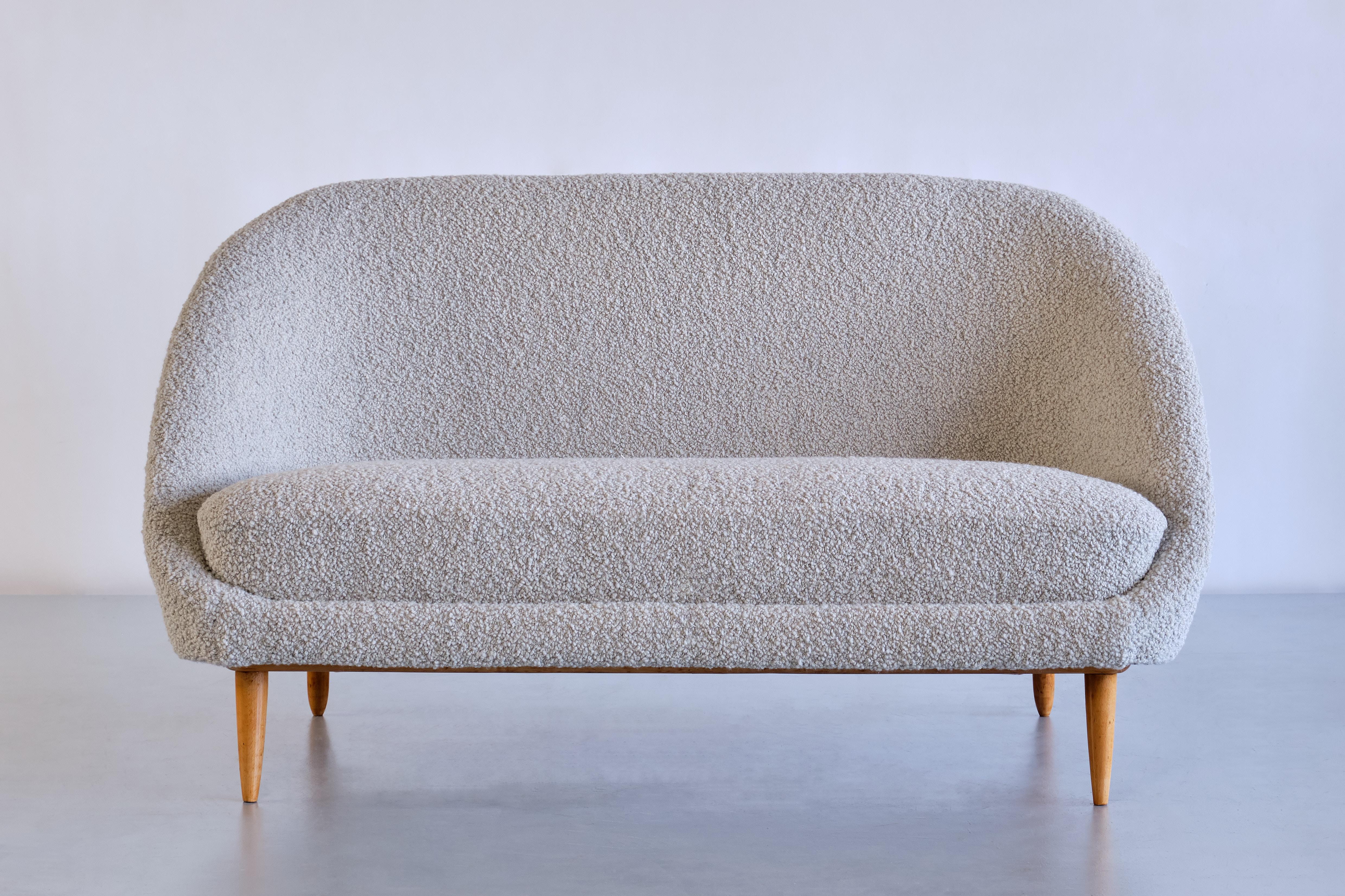 This striking sofa was designed by Theo Ruth in 1958. This model numbered 115 was produced by Artifort in the Netherlands.

The design is marked by the rounded lines of the upholstered seat and the slightly angled positioning of the seat on the