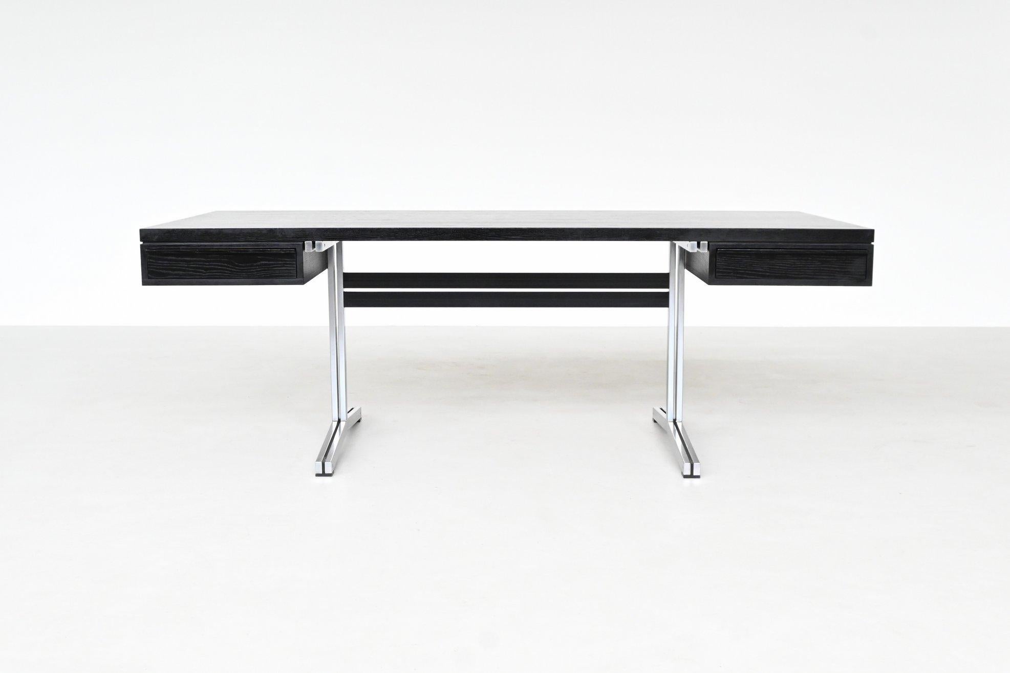 This striking executive desk was designed by Theo Tempelman for AP Originals in the Netherlands, 1960. A refined example of Dutch mid-century design, the piece combines clean architectural lines with practical functionality. The large rectangular