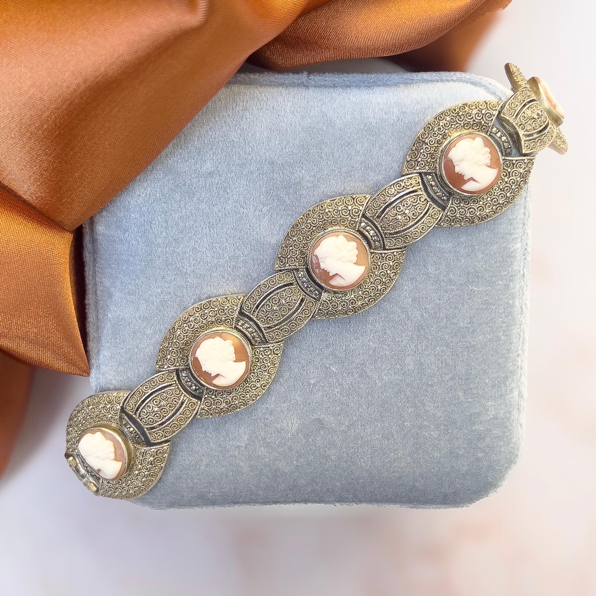 This bracelet is a beautiful example of the 1930s silver work of the German Theodor Fahrner company. 

Condition Report:
Excellent

The Details...
This bracelet is constructed from silver gilt. It is detailed with silver filigree work and features 6