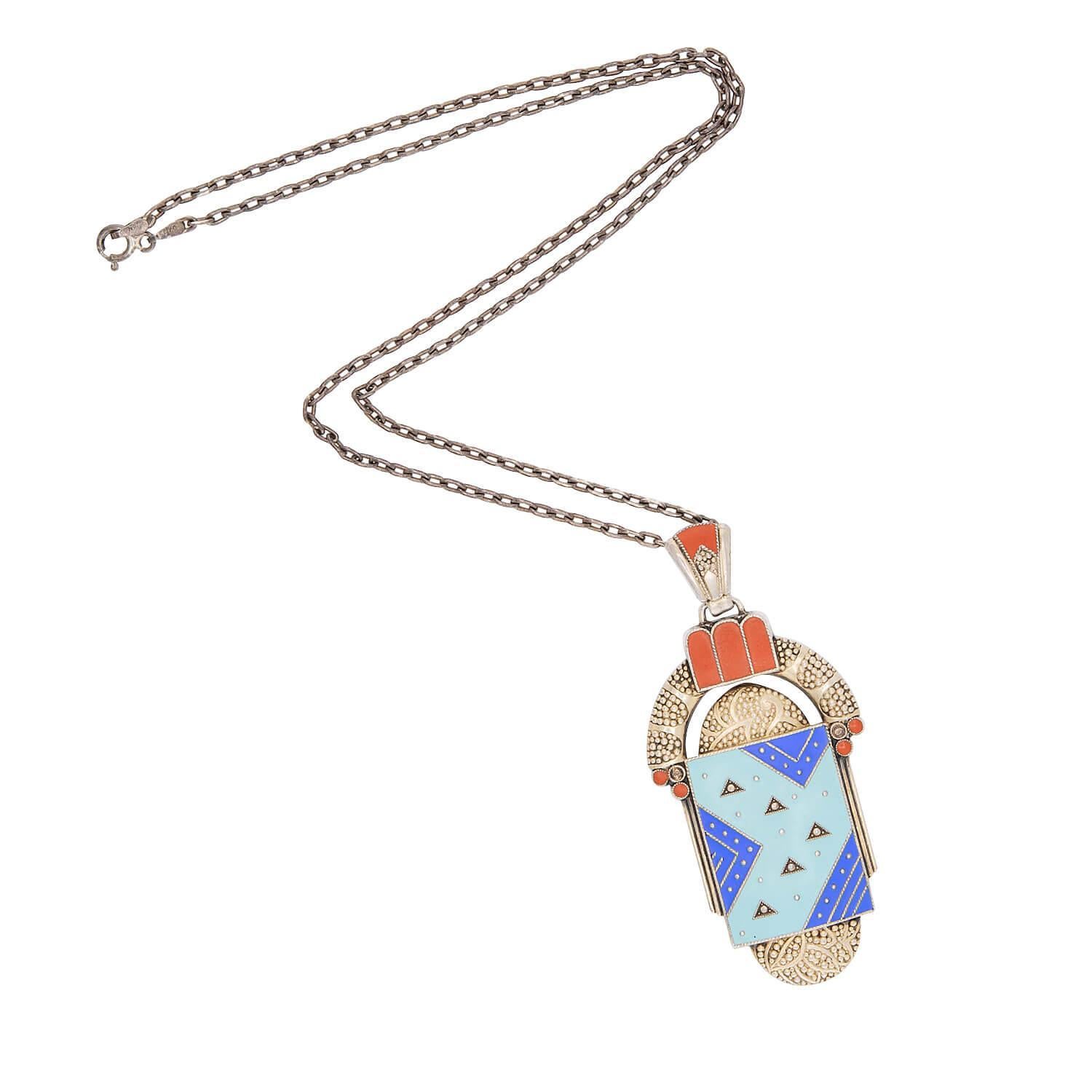 A superb Theodor Fahrner-inspired pendant necklace from the Art Deco (ca1920s) era ! Crafted in sterling silver, this piece features a large centerpiece, which is composed of various juxtaposed geometric shapes. The shapes include an elongated oval,