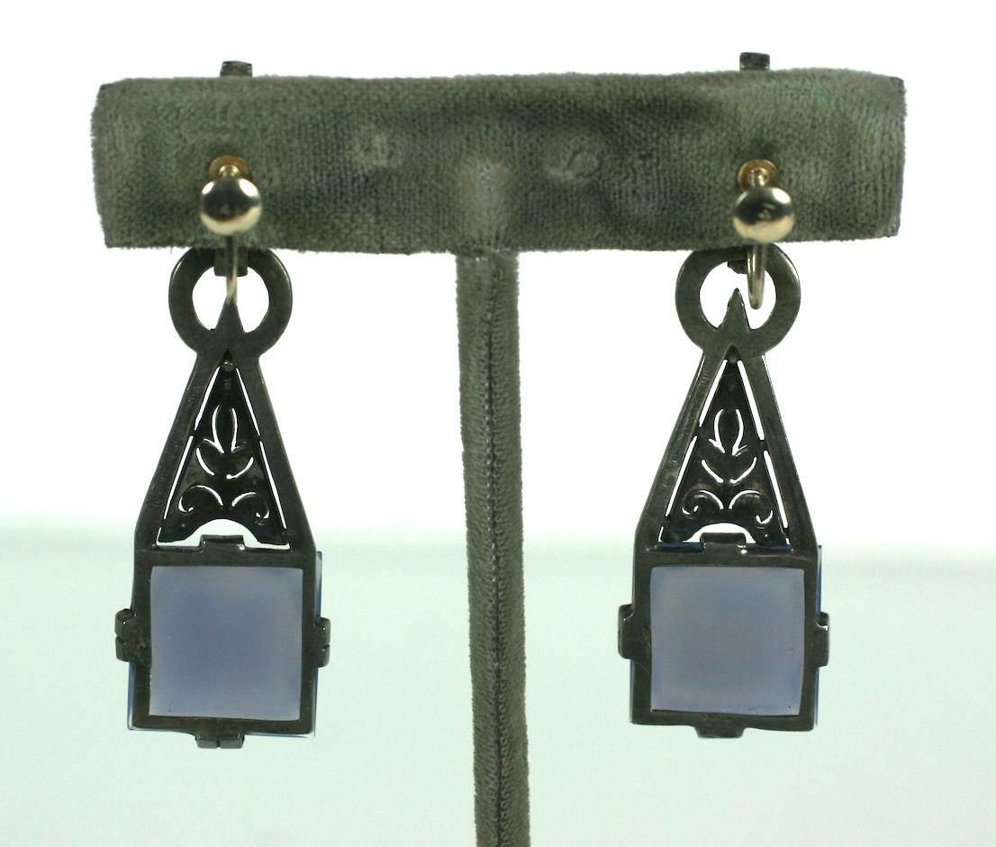 Rare Theodor Farhner Art Deco Chalcedony and Marcasite Earrings from the 1930's.  High style design with bar form ear piece with onyx cabochon with triangular marcasite set motif which sways, suspending a square cut chalcedony in that lilac blue