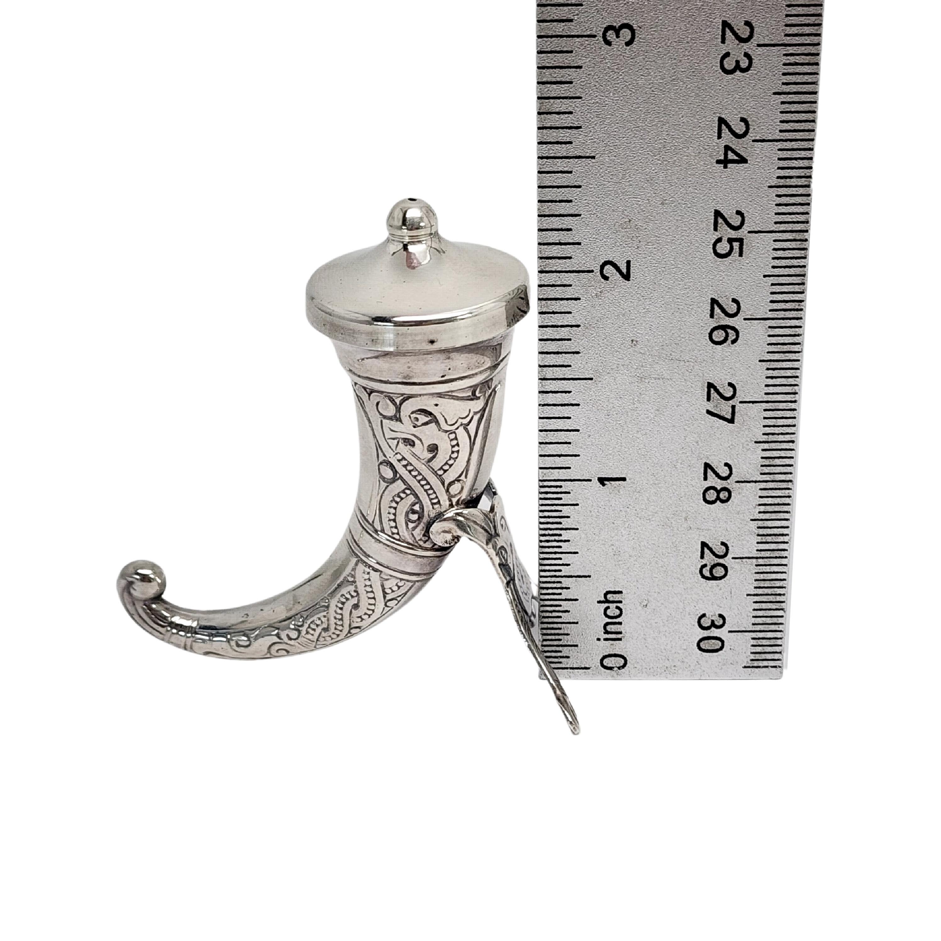 Sterling silver Viking horn pepper shaker by Theodor Olsens of Norway.

Beautifully ornate Viking horn pepper shaker featuring one small hole at the center of the removable lid.

Measures approx 2 1/2