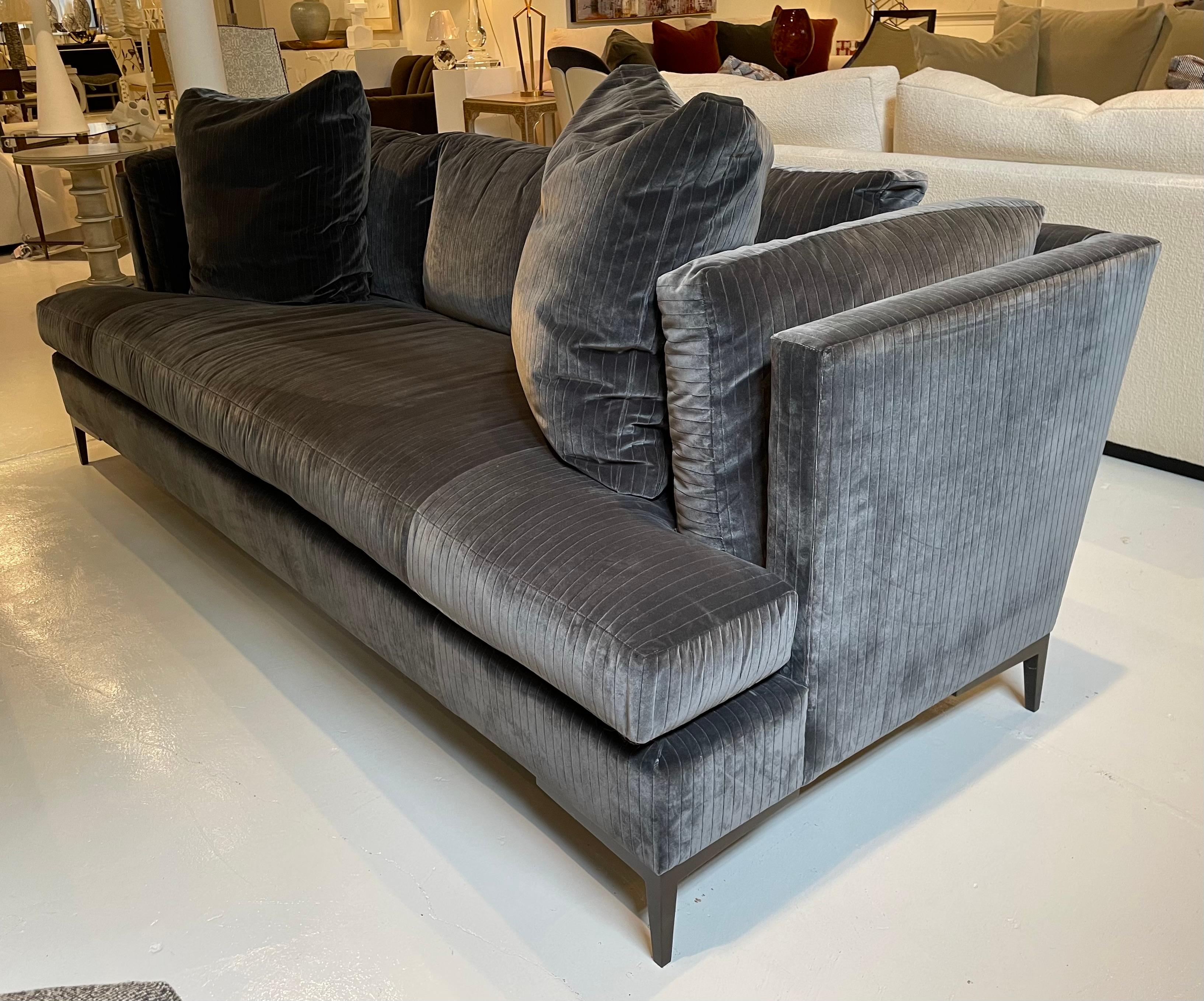 Showroom New.  Theodore Alexander's Most Popular Sofa.  The Aiden is covered in a beautiful rich gray velvet with a subtle stripe detail.  Modern metal Legs are finished in Antique Bronze.  The Aiden has a clean design with a bench seat and 2