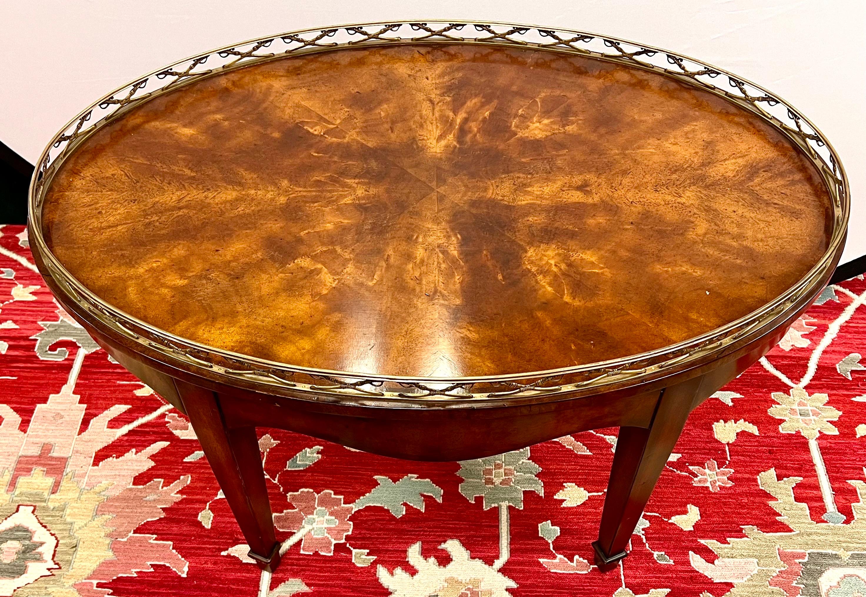 Elegant mahogany cocktail table fitted with a brass gallery of crossed sabres.  There are two hidden drawers on both ends.  Inspired by the 2nd Earl of Spencer, appointed 1st Lord of the Admiralty in 1795.  The original regency.