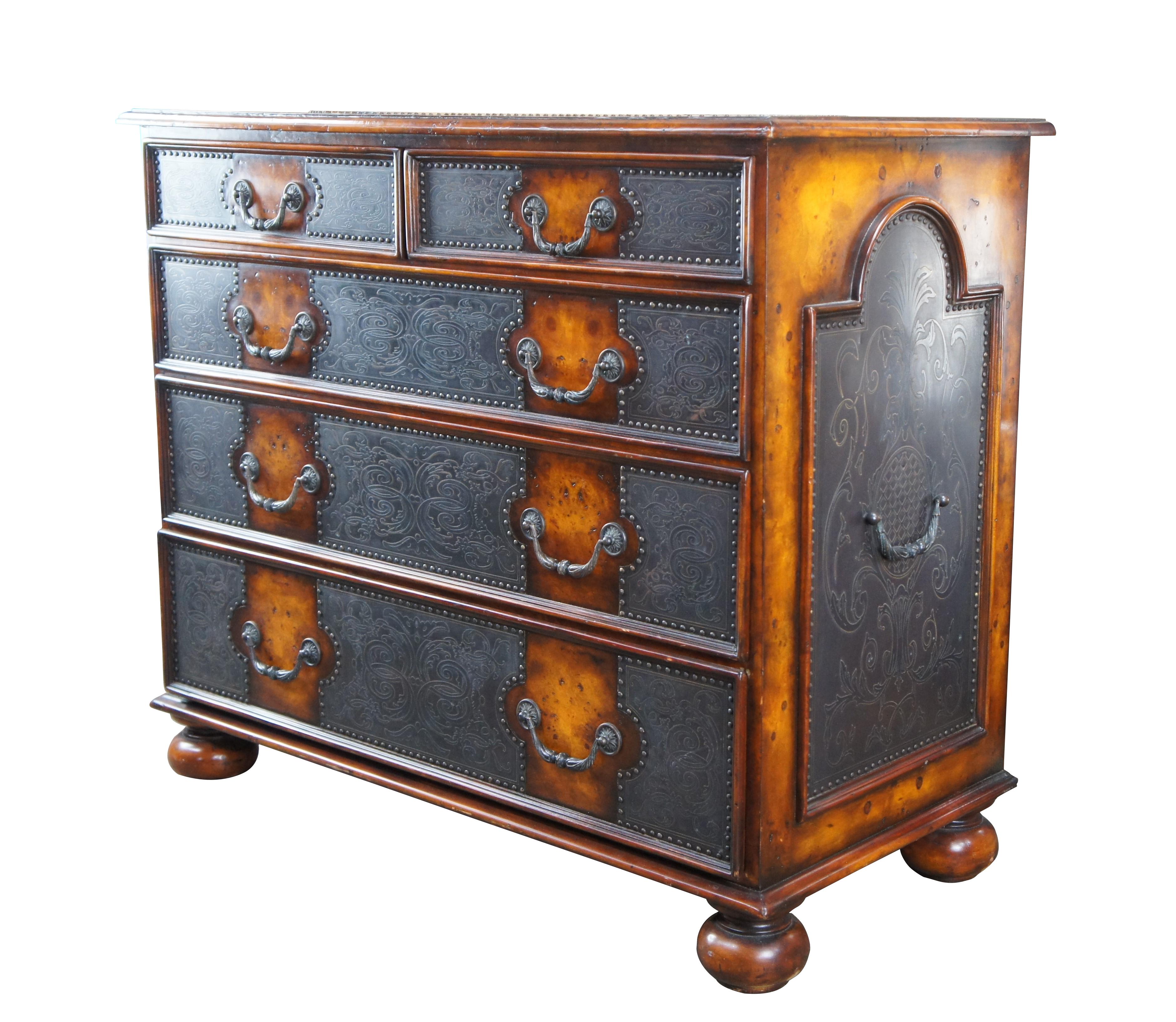 Theodore Alexander Armoury Collection Chest of Drawers. A modern take on 18th Century William and Mary styling. Made from Burr Walnut with etched brass panels and nailhead trim. Features 2 over 3 dovetailed drawer format and robust bun feet. A