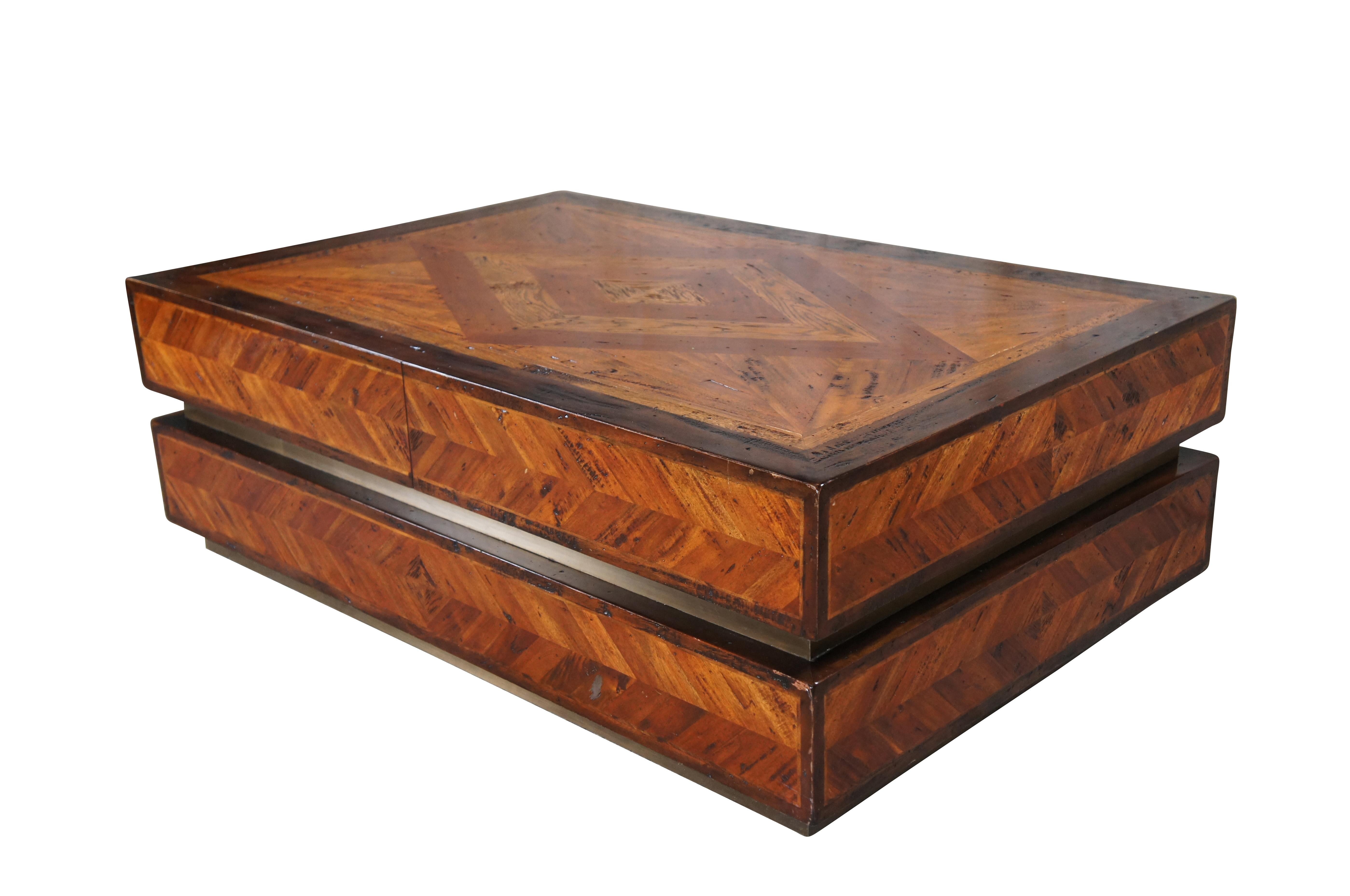 Vintage Theodore Alexander Brunello Sera Cocktail Table; 5100-182. Features a geometric lozenge parquetry fashioned out of hand selected acacia, oak and parawood. Concealed drawers provide storage space without detracting from the look of the piece,