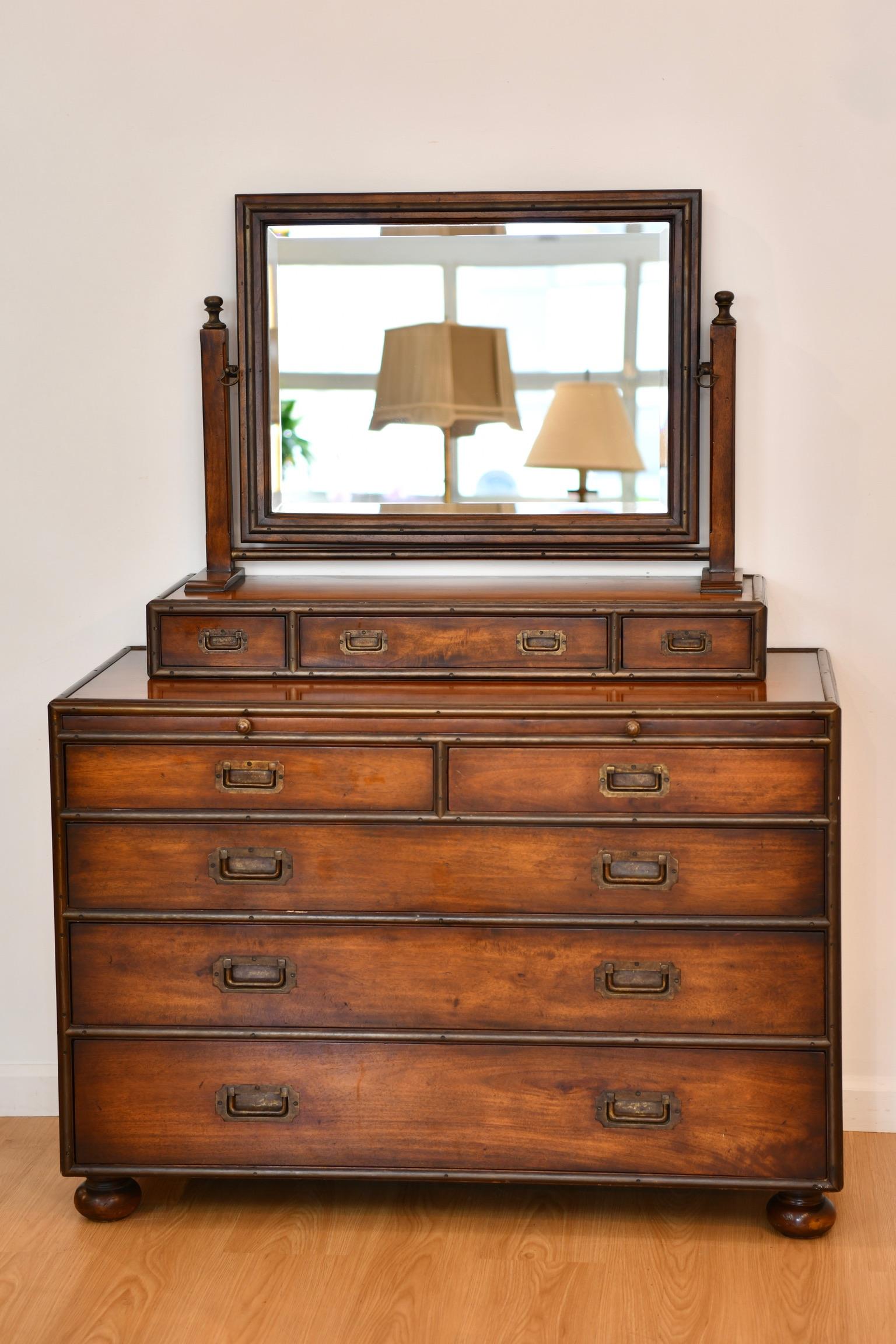Theodore Alexander campaign style mahogany and metal dresser on bun feet with resting mirror (not attached but can be). Dimensions: (base) 30.5