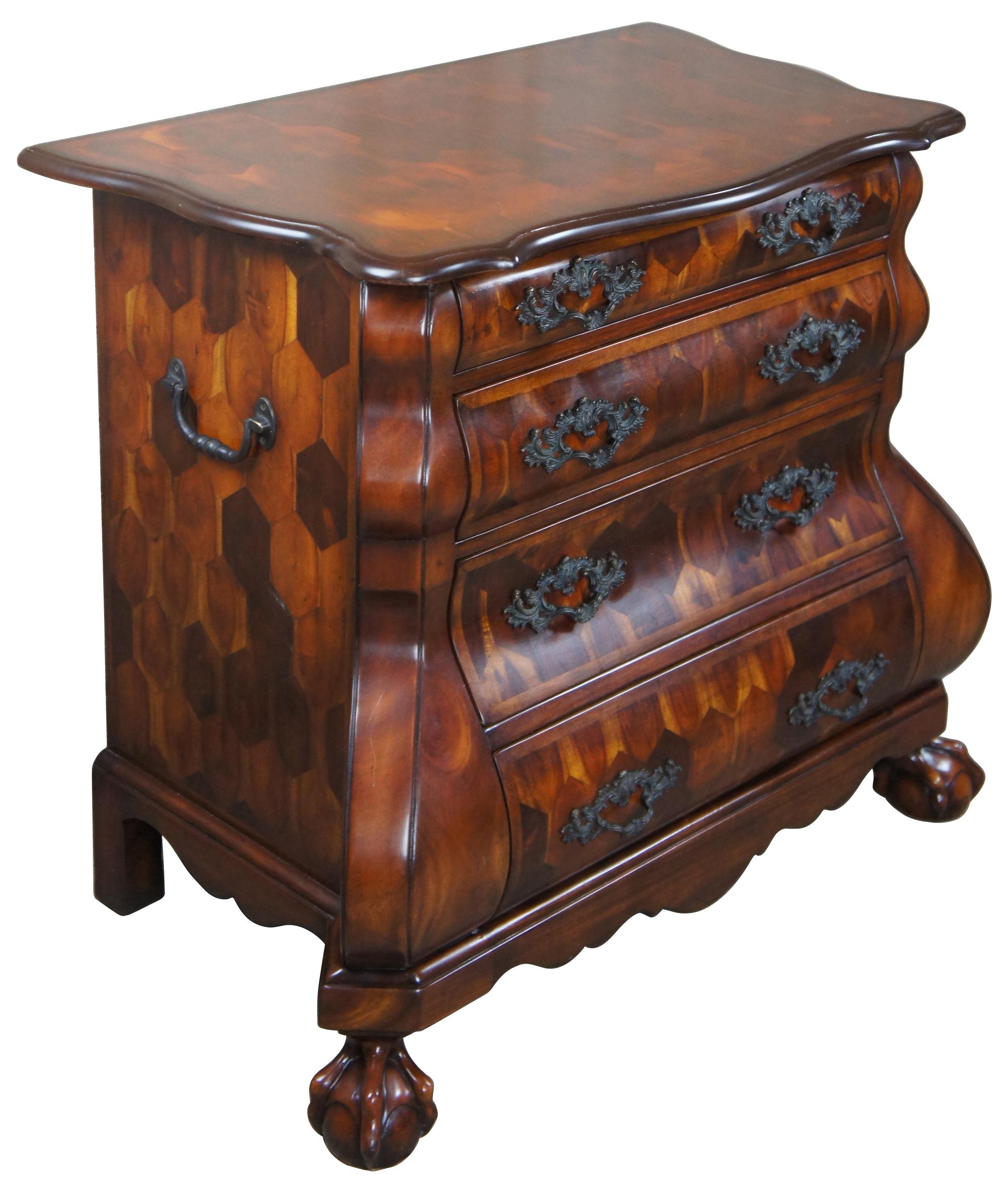 Theodore Alexander Dutch bombe chest. Influenced by a combination of 18th century Dutch and Chippendale styling. Features a serpentine design made from mahogany with four drawers, ornate hardware, ball and claw feet and geometric parquetry finish. A
