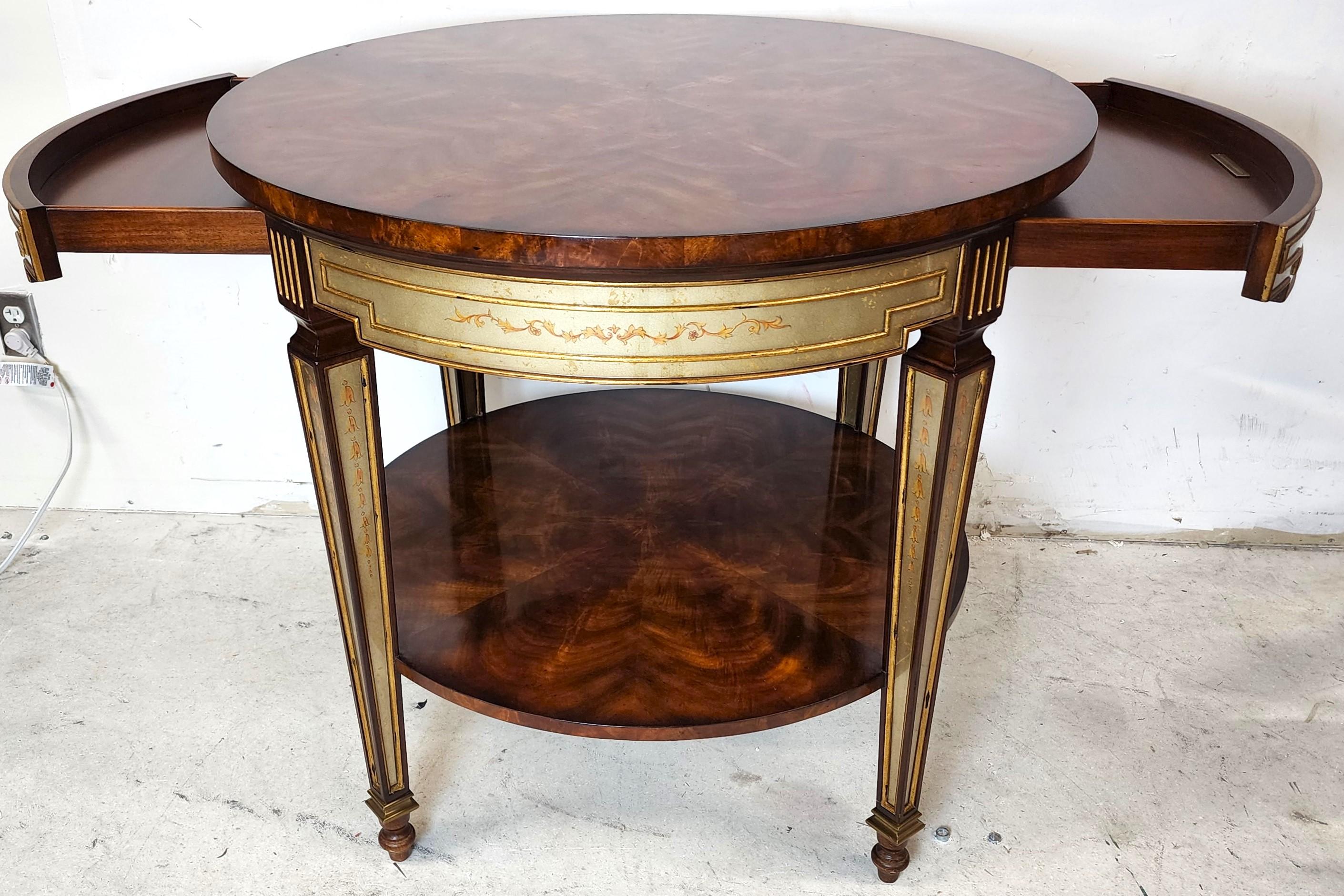 Offering one of our recent palm beach estate fine furniture acquisitions of a
Theodore Alexander regency 2-drawer Eglomise Mirrored occasional side table.
Featuring 2 drawers on either side and flame mahogany top and bottom surfaces.

Approximate