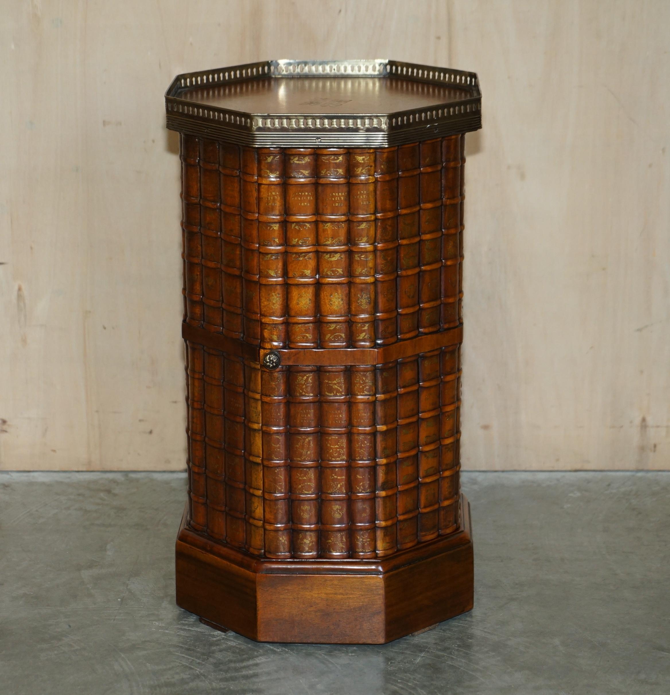 We are delighted to offer for sale this lovely Theodore Alexander faux book side table with embossed brown leather top and brass gallery rail.

A very nicely made side table in solid hardwood, it has a faux books on all sides which is reminiscent