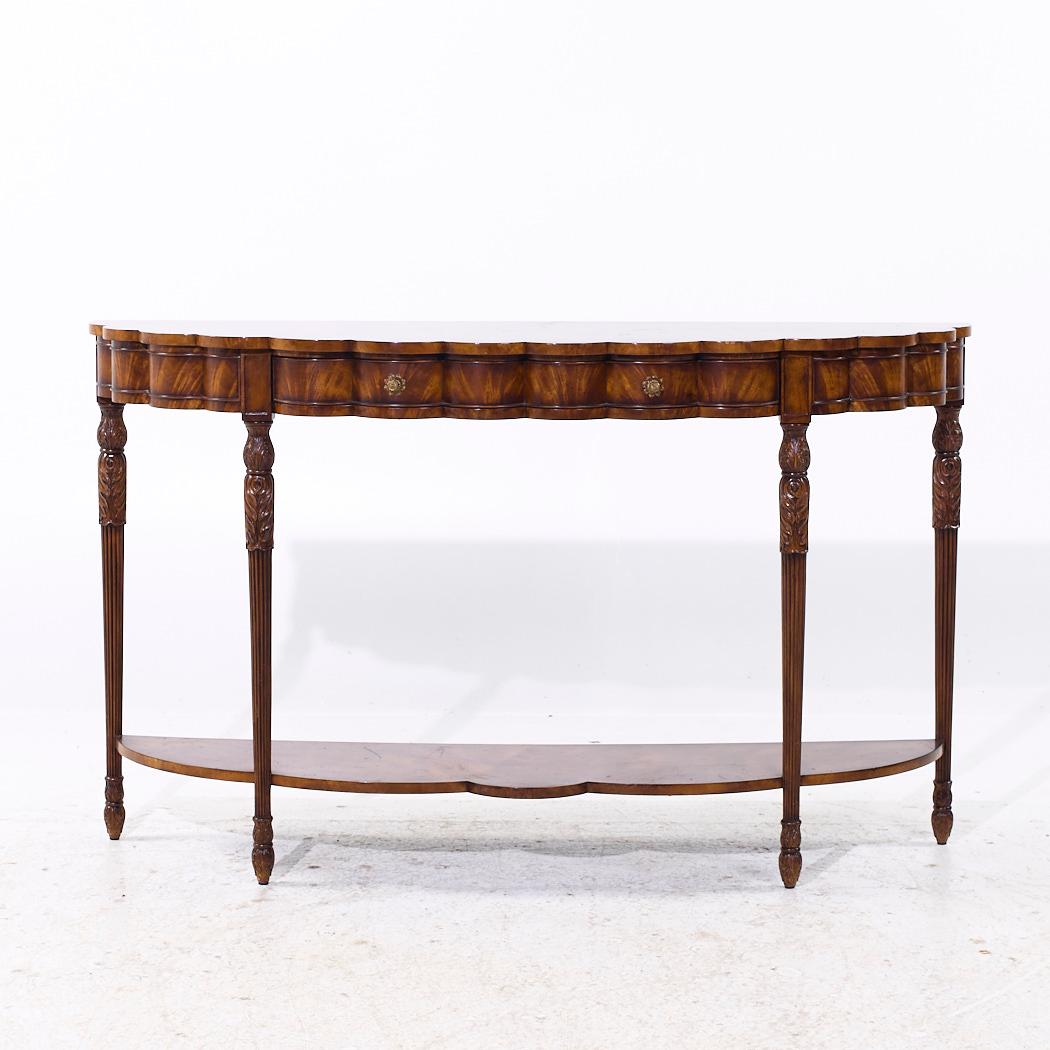 Theodore Alexander Flame Mahogany Bow Front Console Table

This console table measures: 60.5 wide x 18 deep x 36 inches high

We take our photos in a controlled lighting studio to show as much detail as possible. We do not Photoshop out