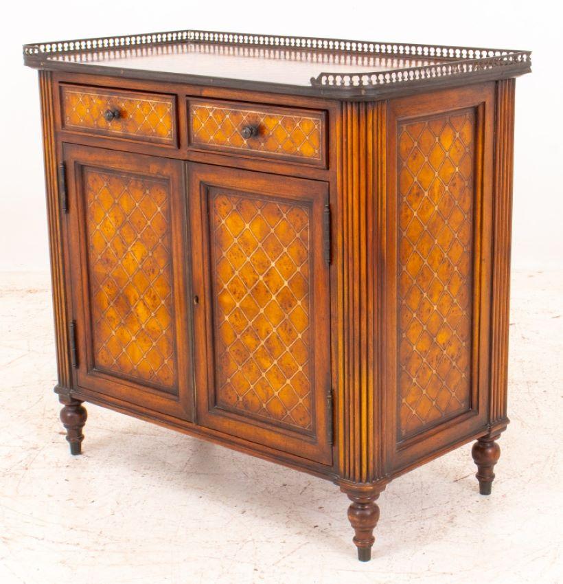 Neoclassical Theodore Alexander Louis XVI taste small cabinet with D-shaped galleried top with stained trellis pattern surface, above two short drawers (one marked to interior) and two cabinet door s similarly stained, between reeded pilasters on
