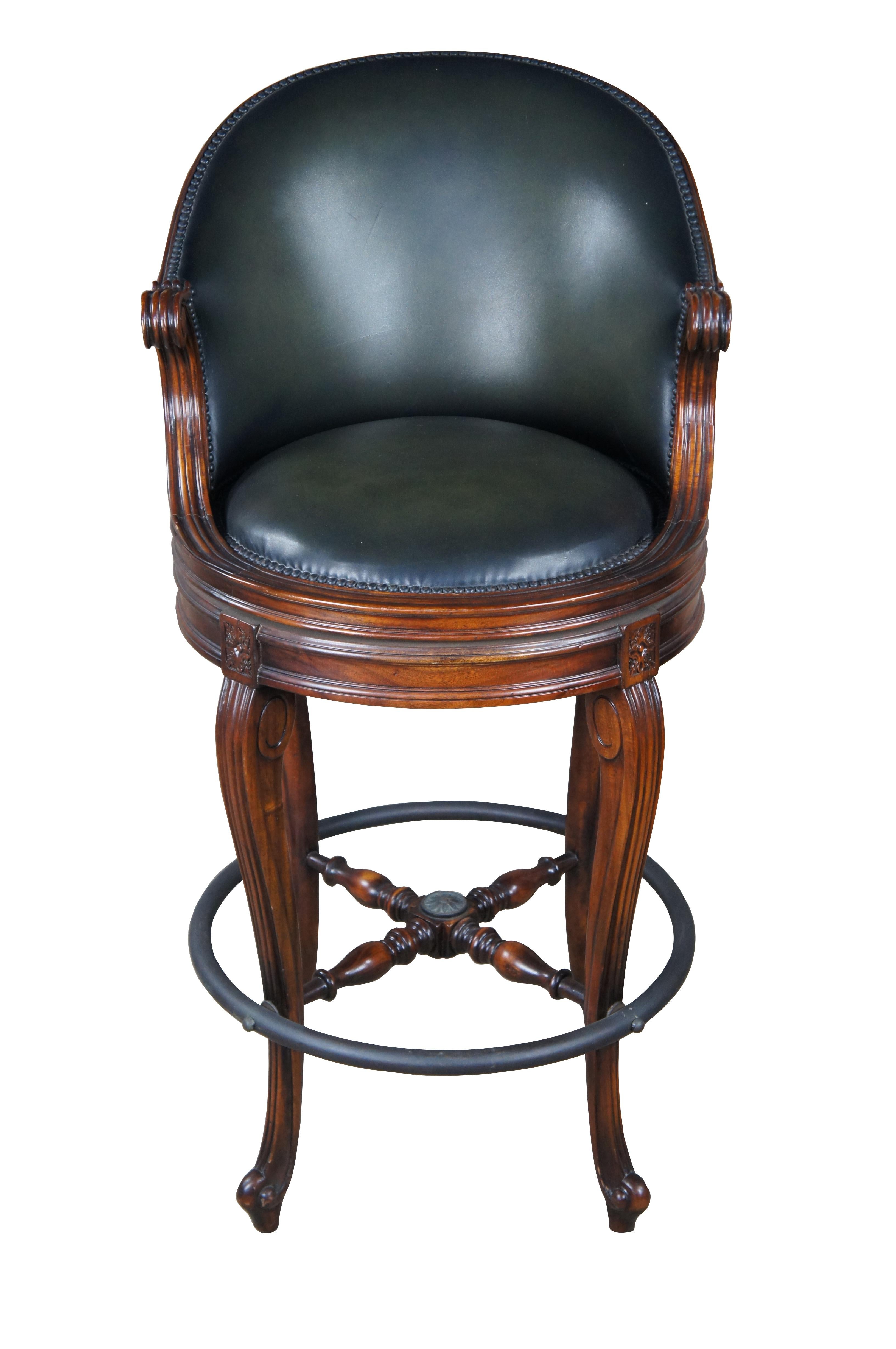 An Evening At Ease by Theodore Alexander.  Inspired by Napoleon III and Louis XV styling.  Features a hand carved mahogany scoop back, a padded green leather upholstered seat, with scroll arms and cabriole legs with a verdigris brass foot rest. 