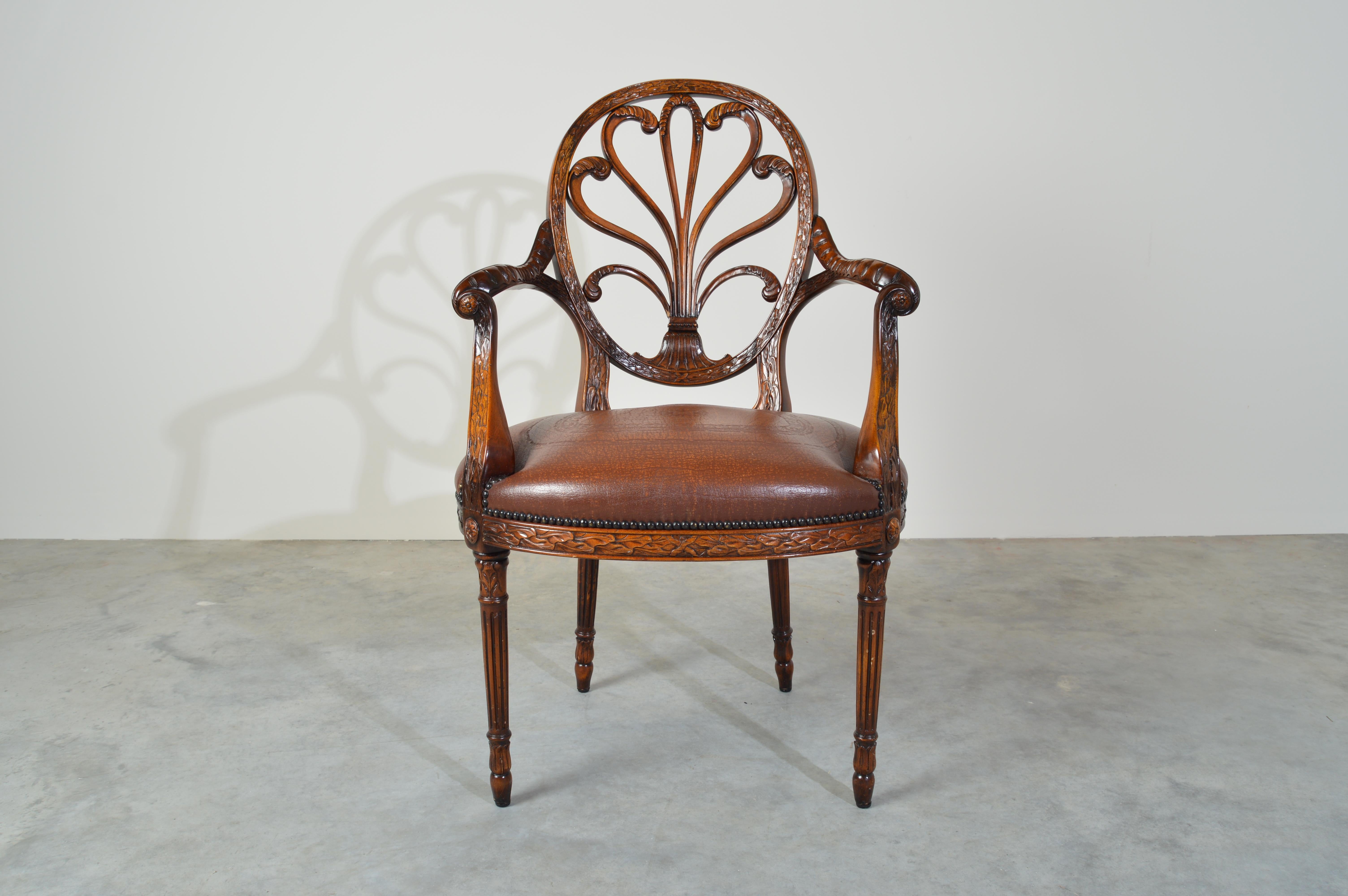 Theodore Alexander neoclassical carved back open armchair having tooled leather seat with scrolled armrests.
Outstanding condition. Well maintained ready for use.