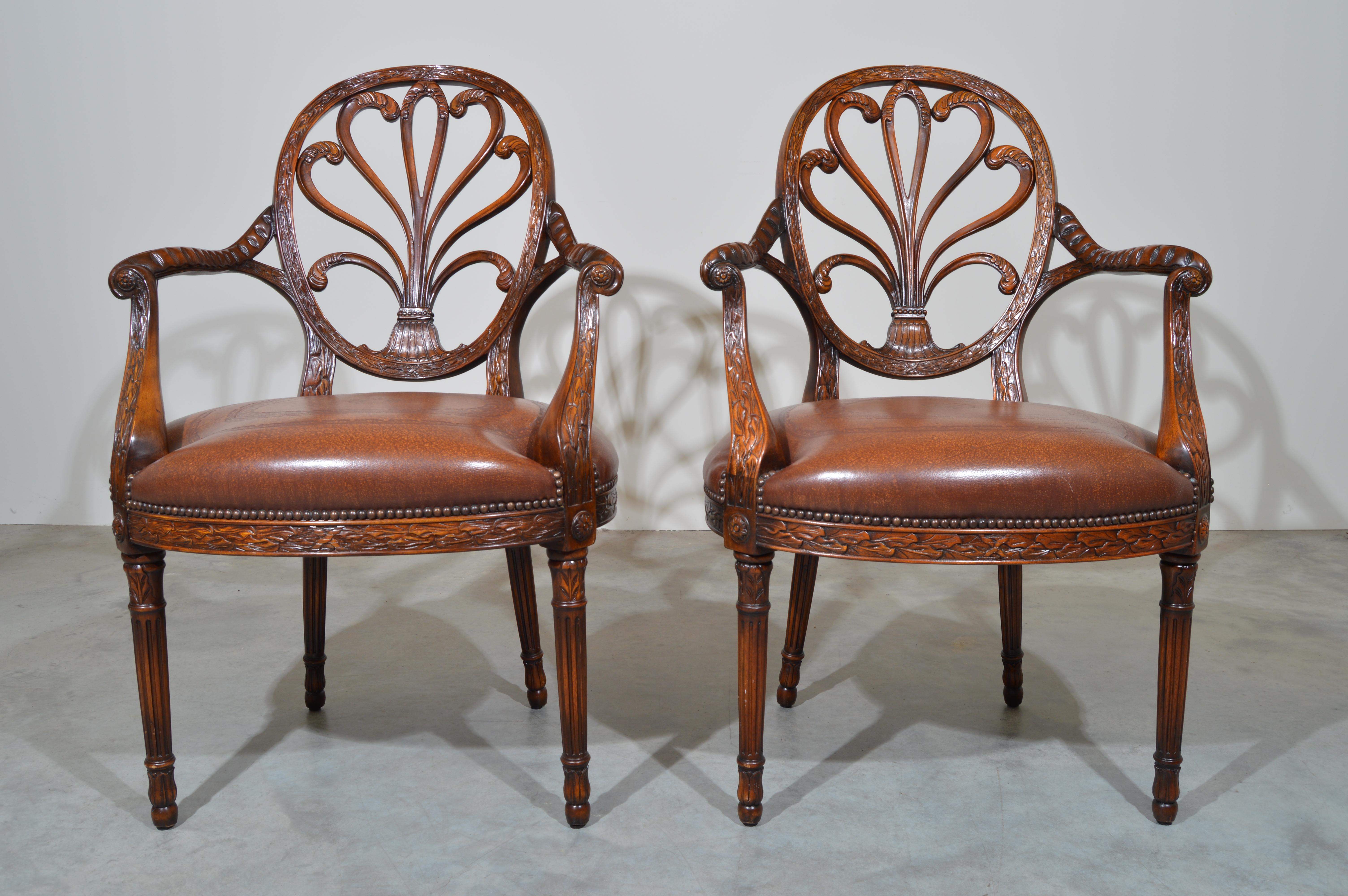 Elegant pair of Theodore Alexander neoclassical carved back open armchairs having tooled leather seat with scrolled armrests.
Outstanding condition. Well maintained ready for use.