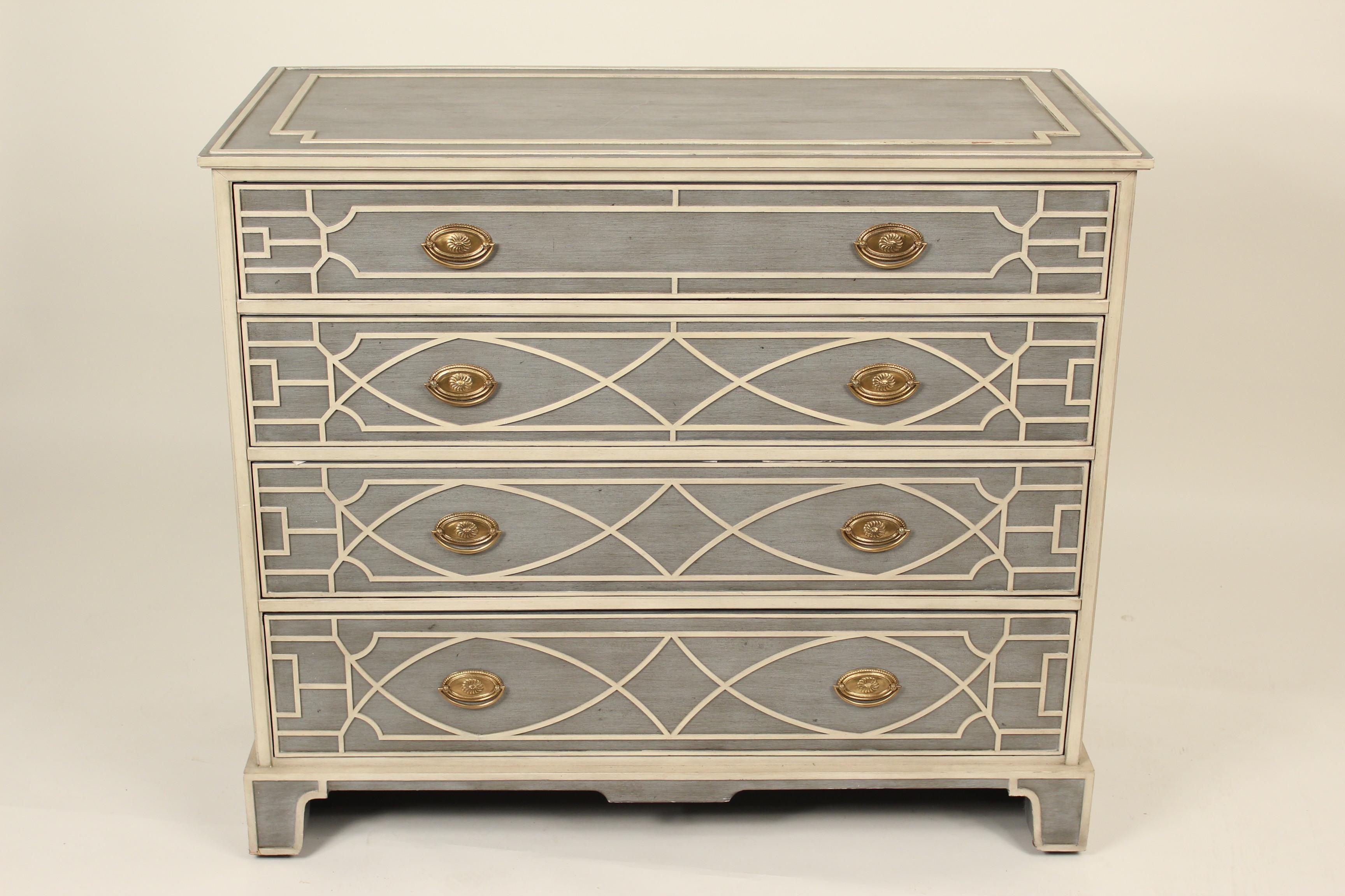 George III style painted chest of drawers, made by Theodore Alexander, circa 2000. The white lattice style decoration and moldings are raised.