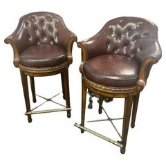 Theodore Alexander pair of swivel barstools in fine burgundy leather