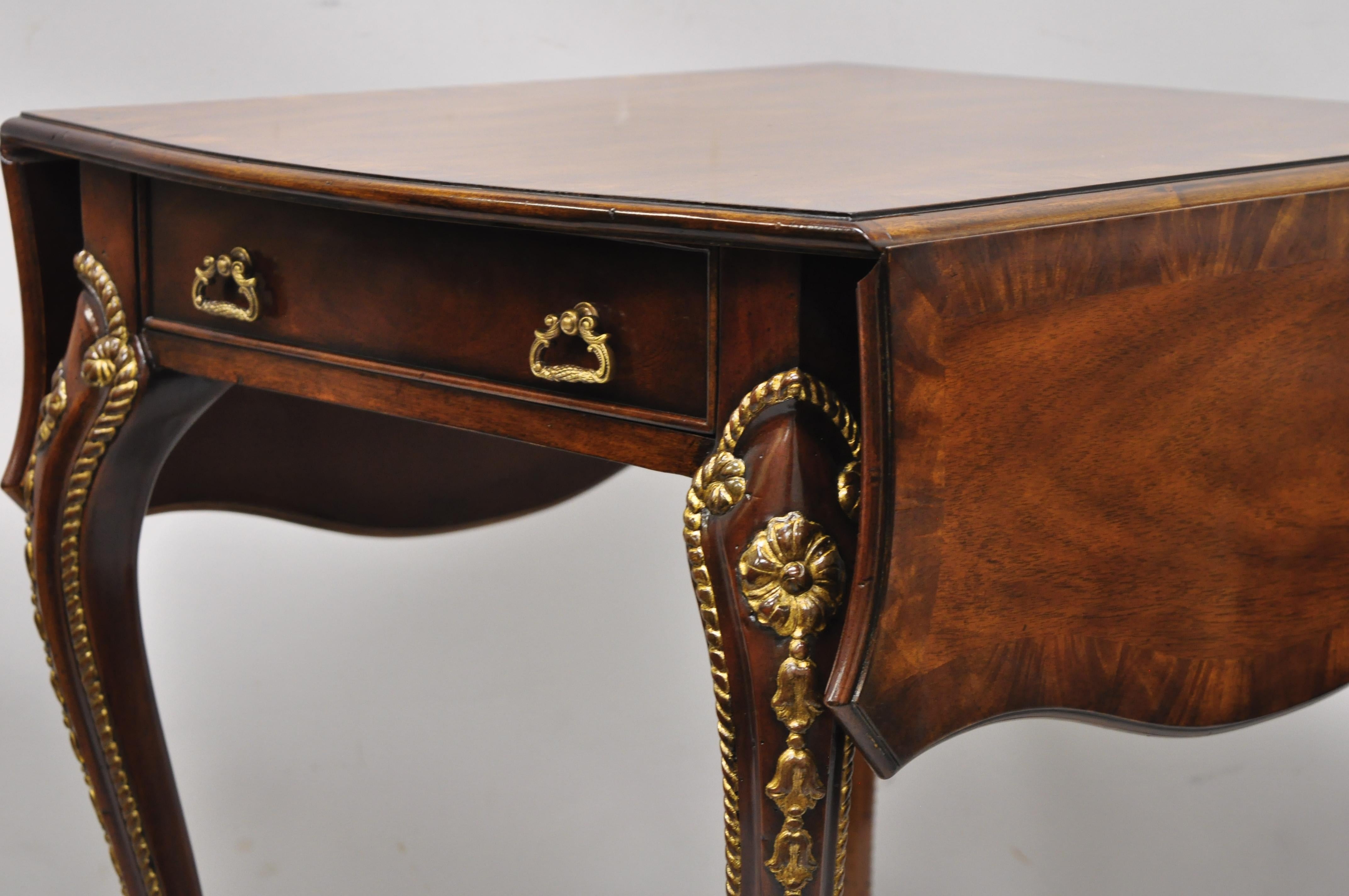 Theodore Alexander Replica English George III circa 1775 Pembroke drop-leaf table. Item features serpentine drop leaf top, rope carved cabriole legs, solid wood construction, beautiful wood grain, original tags and paperwork, 2 dovetailed drawers,