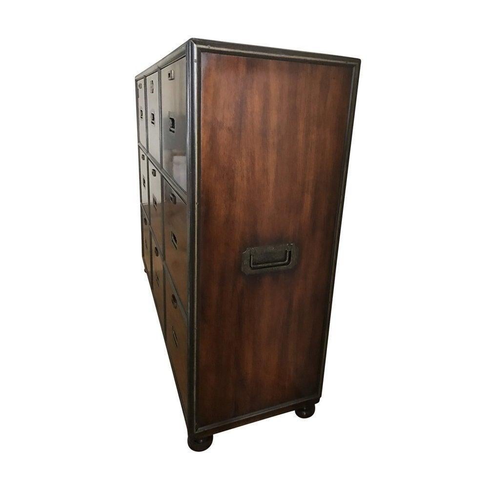 Features mahogany finish and antiqued brass trim and drawer pulls.

Each file drawer can accommodate hanging letter-size file folders and features antiqued brass interior fittings.
Brass company name plate adds a vintage feel.
Materials: