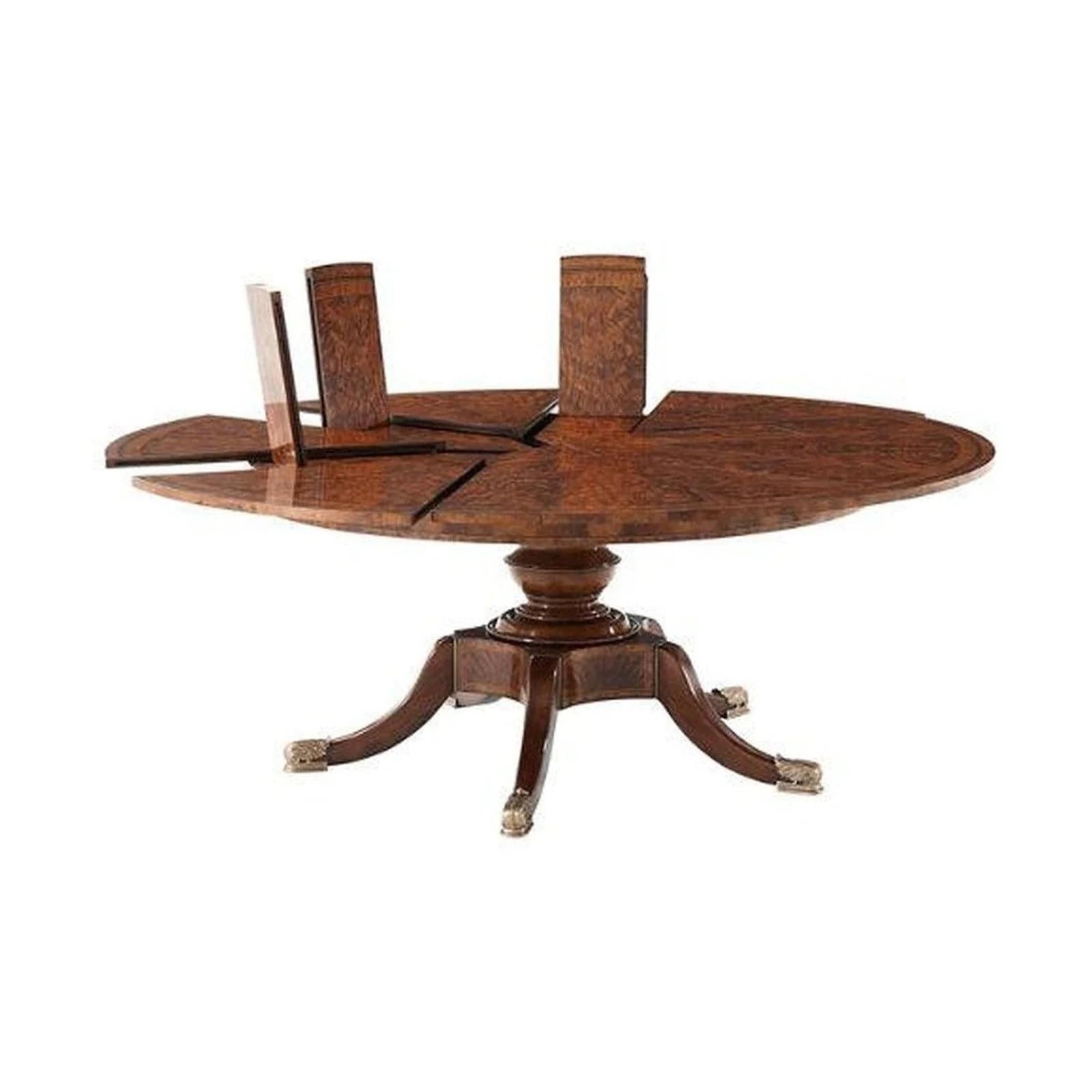 The Theodore Alexander Althorp Patent Jupe Extendable Table combines timeless elegance with ingenious design, making it a statement piece for any refined dining space. Crafted with exceptional craftsmanship, this table draws inspiration from