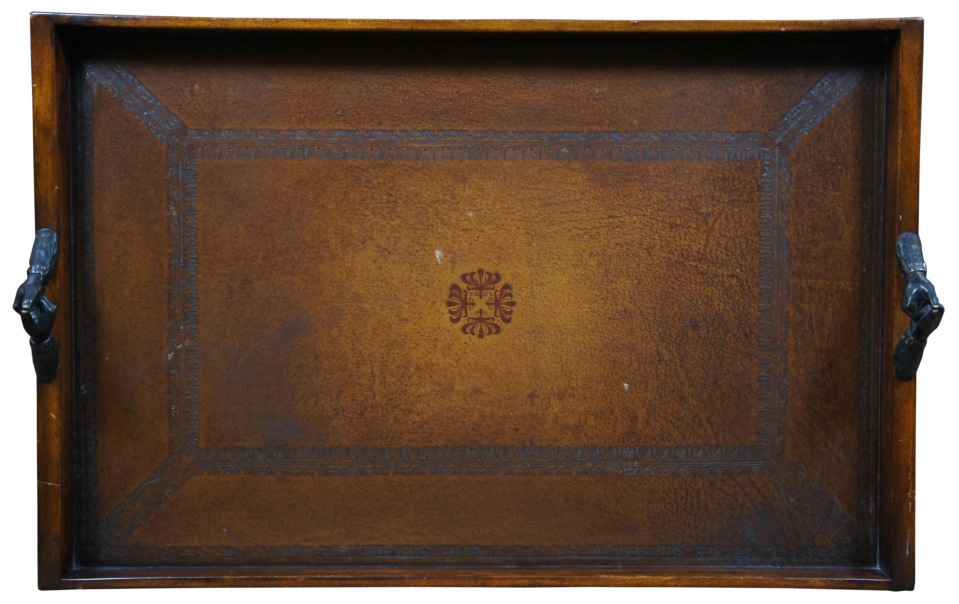 Theodore Alexander Victorian library tray made of wood with rectangular form and gallery with a tooled leather surface and bronze clasping handles. 1100-842BD

Height to top of handle – 4.75”.