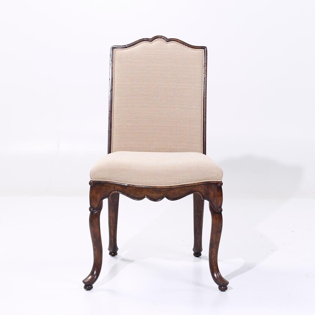 Theodore Alexander Upholstered Walnut Dining Chair

This chair measures: 21.5 wide x 24.5 deep x 40.75 inches high, with a seat height/chair clearance of 20.5 inches

We take our photos in a controlled lighting studio to show as much detail as