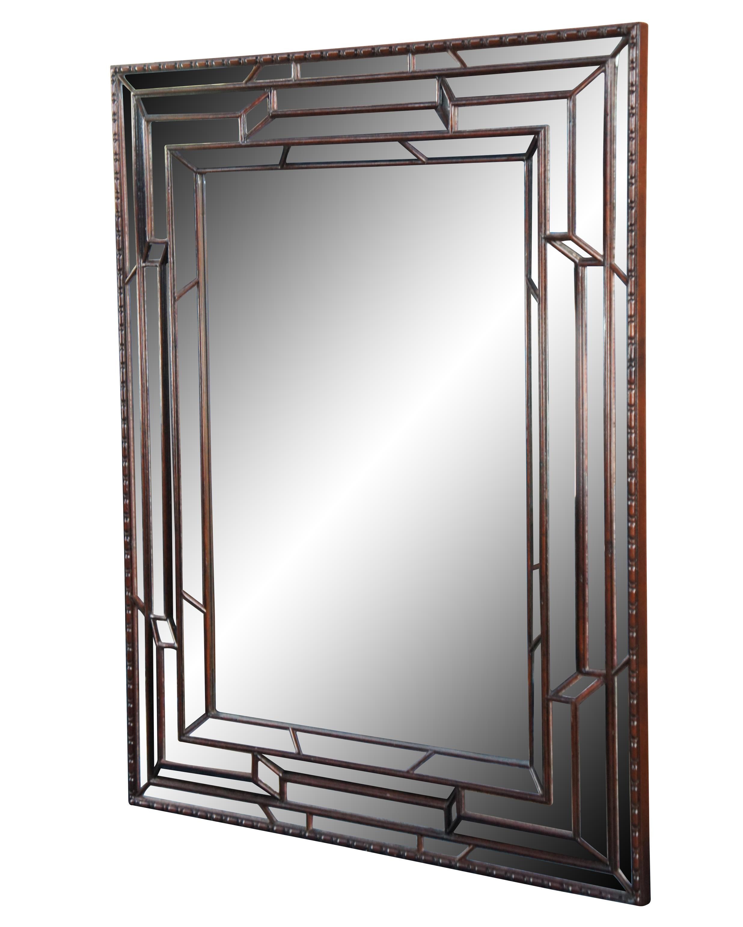 Vintage Theodore Alexander Pavlovsk Collection mirror. Made of mahogany featuring Art Deco styling with rectangular and with geometric beveled design. Measure: 46