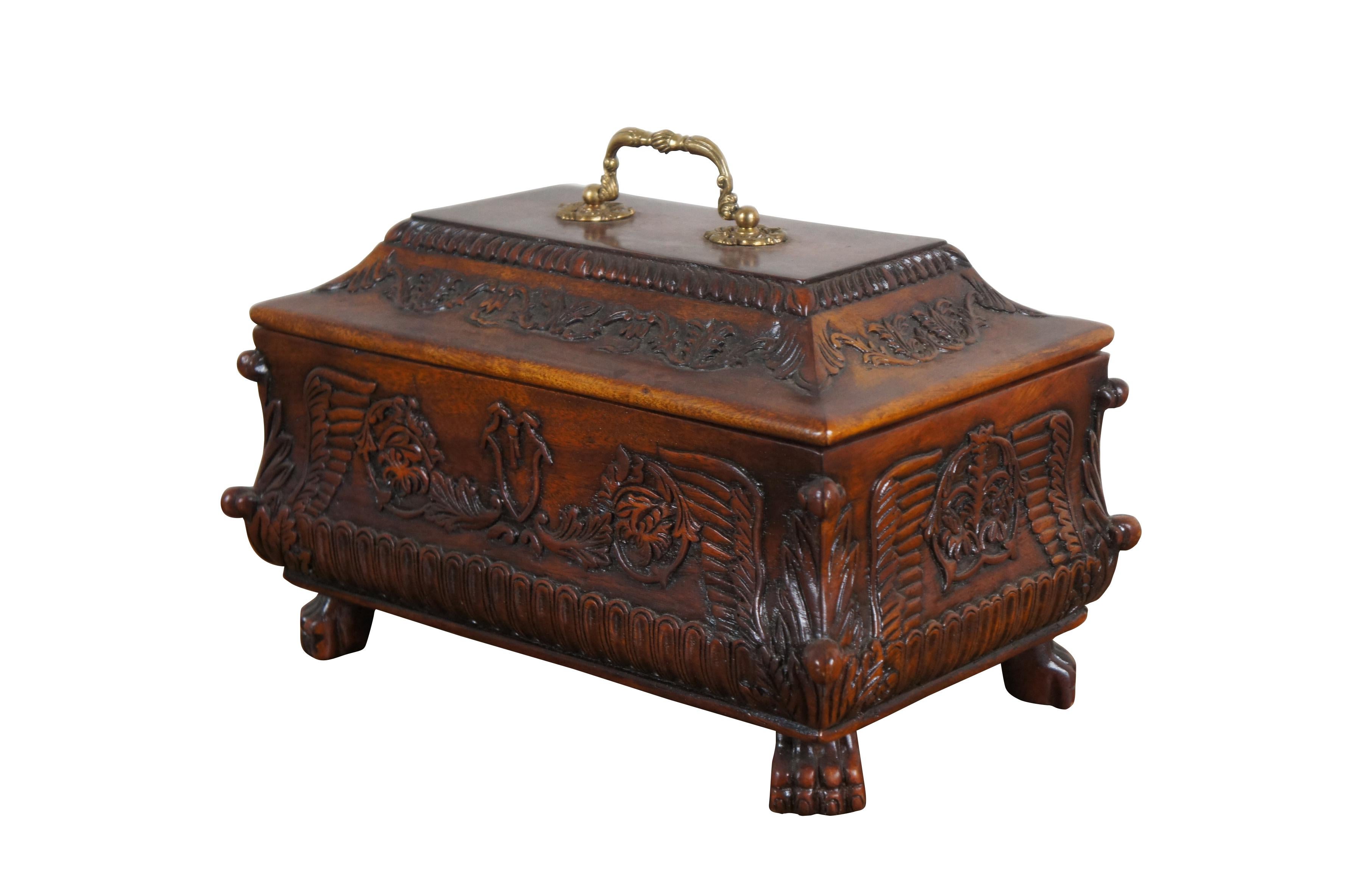 Vintage Theodore Alexander walnut tea caddy / trinket box. Carved in French Empire / Rococo style with shields, foliate designs and winged corners over four claw / paw feet. Foliate gilt brass bail handle.

Dimensions:
13