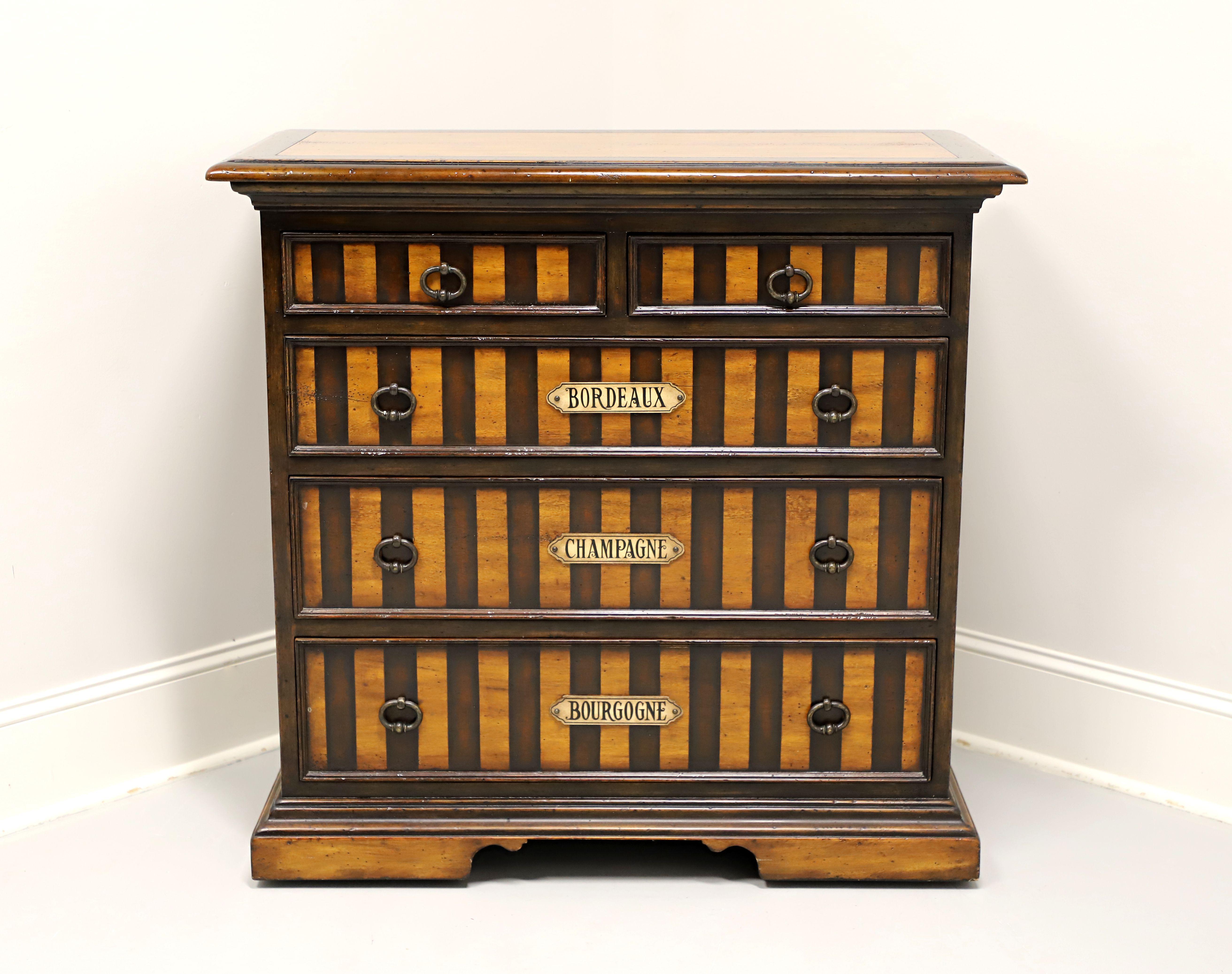 A Regency style occasional chest by Theodore Alexander. Walnut with a distressed finish, lighter and darker finish inlays, banded top with bullnose edge, brass ring hardware, and a bracket appearing solid base. Features two smaller over three larger