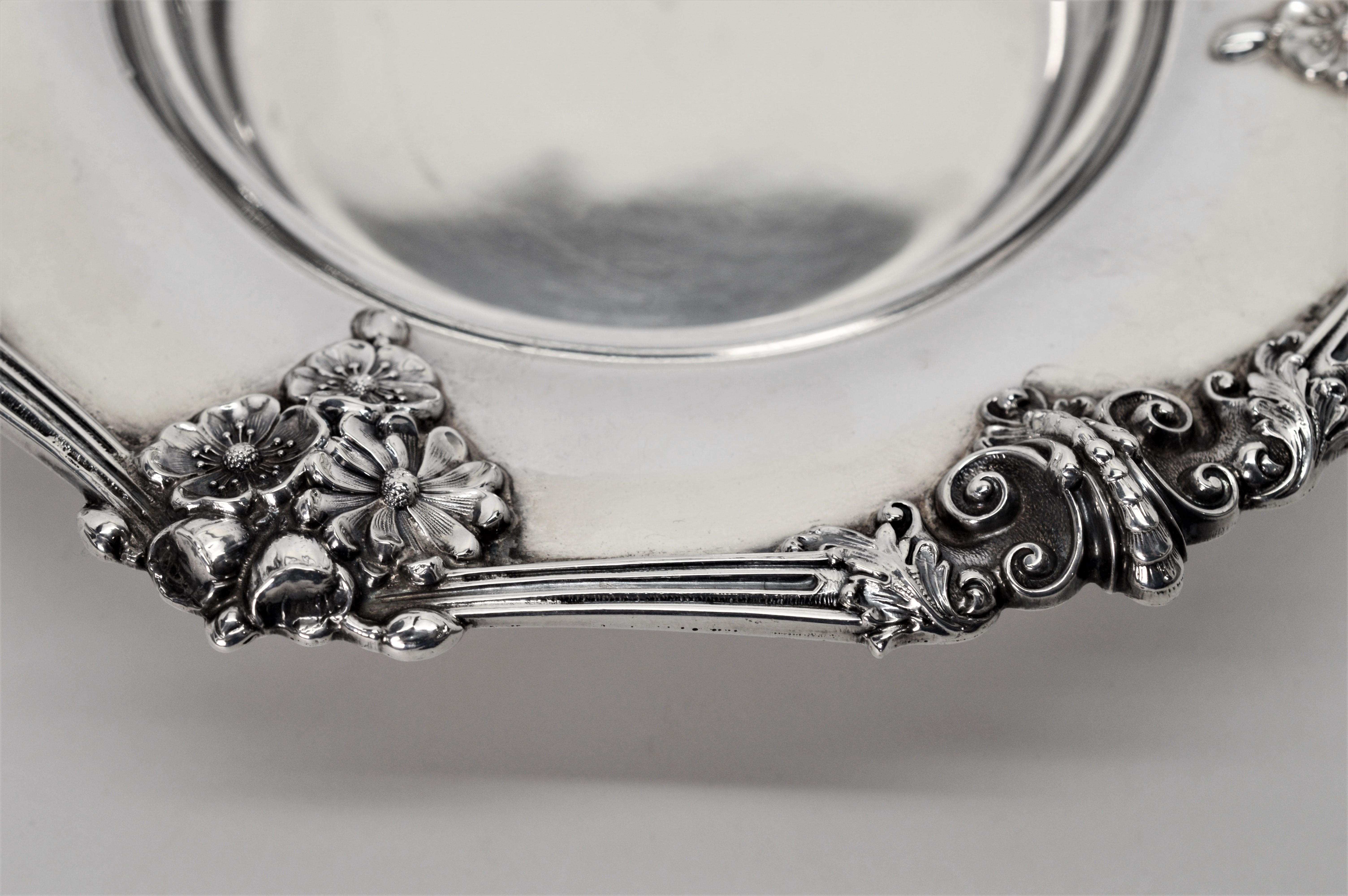 Theodore B. Starr Sterling Silver Bowl 2691. Overall measurement is 7-1/4 inches including a beautiful decorated floral patterned rim. The usable depth is 3- 1/2 diameter by 3/4 inch deep. The decorative rim is 1-1/2 inch wide.  New York City circa