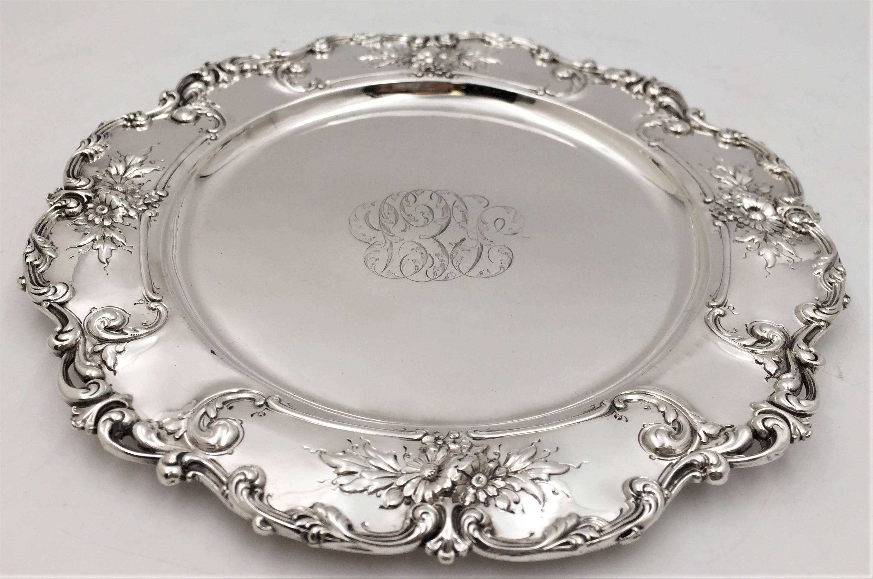 Theodore B. Starr sterling silver round tray/ plate, circa 1900, in a beautiful raised floral pattern typical of the Art Nouveau style. This tray measures 12