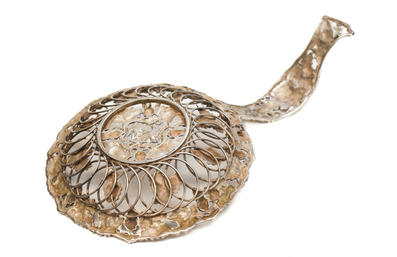 Theodore B. Starr sterling silver pierced fruit strainer #2587, circa 1900

Applied grapes and leaves throughout with branch like texture. Marked 