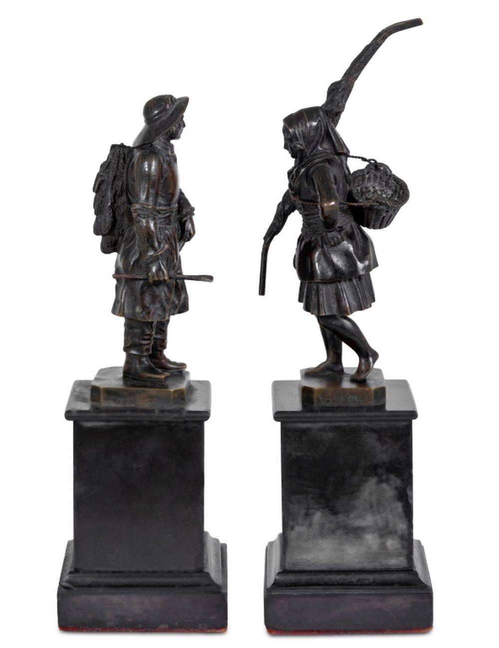 Theodore Jacques Nicolas Blad (French, 1795-1855) Pair of Patinated Bronze Sculptures, mid-19th century, depicting a fisherman carrying a barrel and nets and his wife carrying a basket and a folded net on black slate plinths, signed. Taller overall: