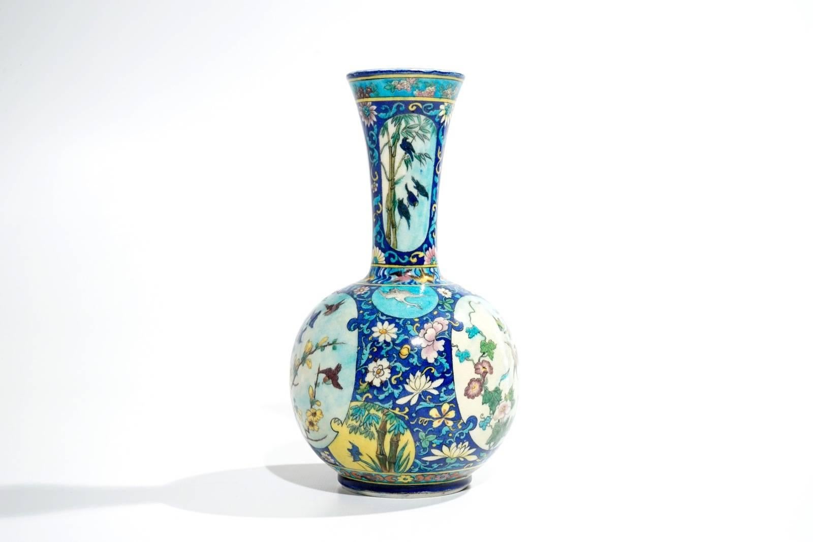 A Theodore Deck (1823-1891) polychromed Faience Baluster vase, the body richly decorated with vegetation’s, birds, butterflies and stork in the Japanese Taste in Cloisonné Imitation
Impressed TH.DECK mark under the base.
circa 1870.